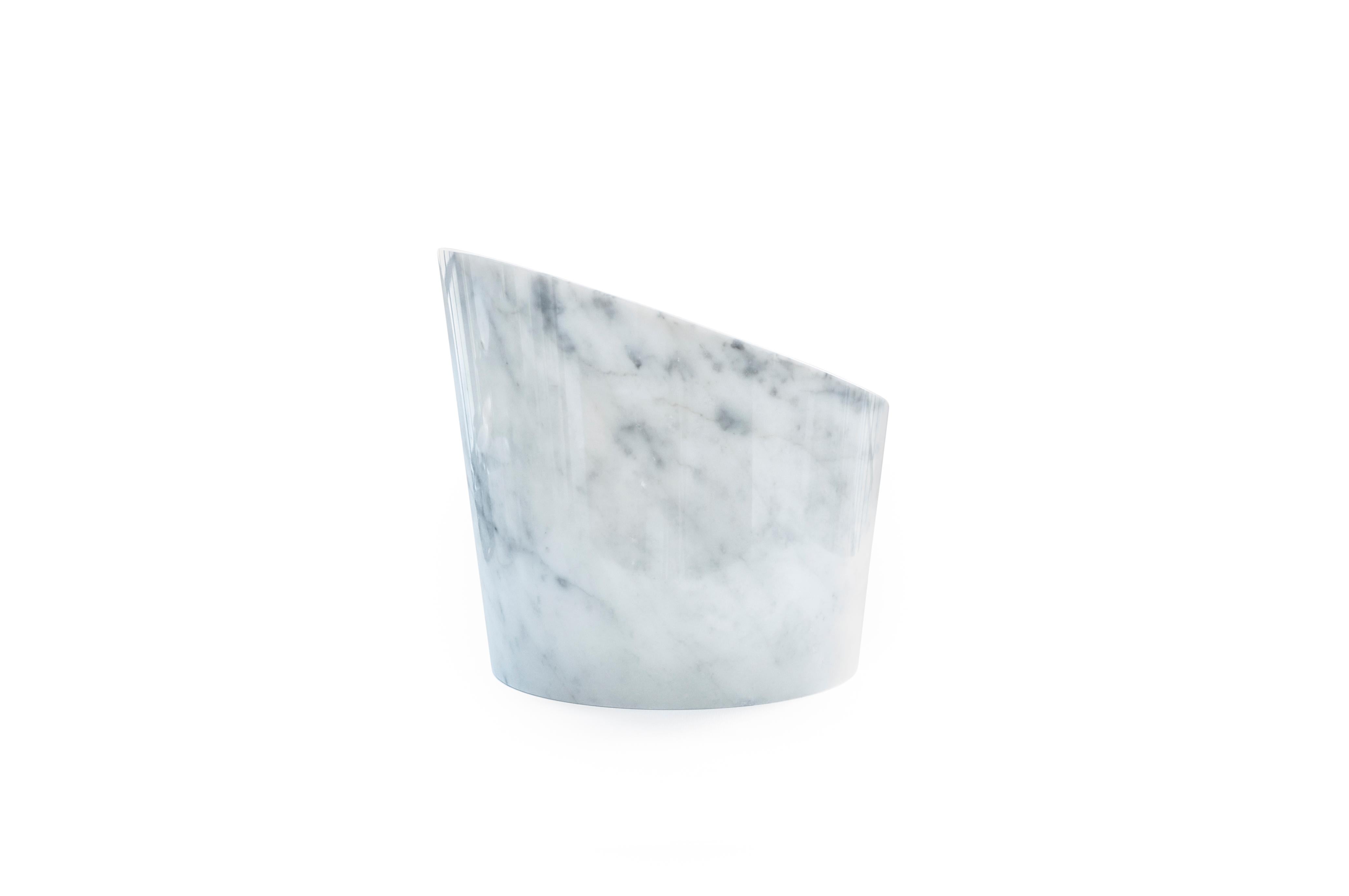 Big white Carrara marble glacette for 4 wine and champagne bottles. Each piece is in a way unique (since each marble block is different in veins and shades) and handcrafted in Italy. Slight variations in shape, color and size are to be considered a