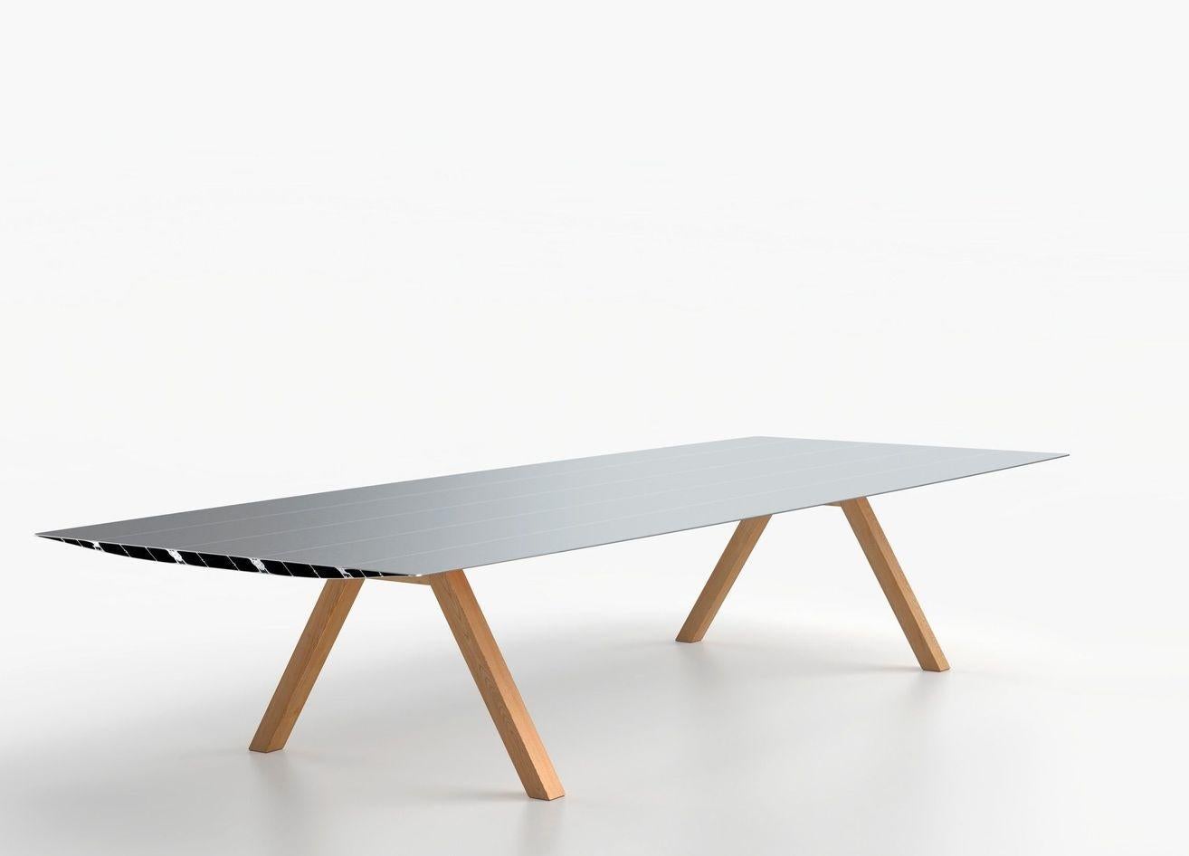 Big wood table B by Konstantin Grcic
Dimensions: D 150 x W 300 x H 74 cm 
Materials: Tabletop in extrusioned aluminium with open ends cut at 45º. There is the option of the surface being laminated in a natural oak effect with a varnished finish.
