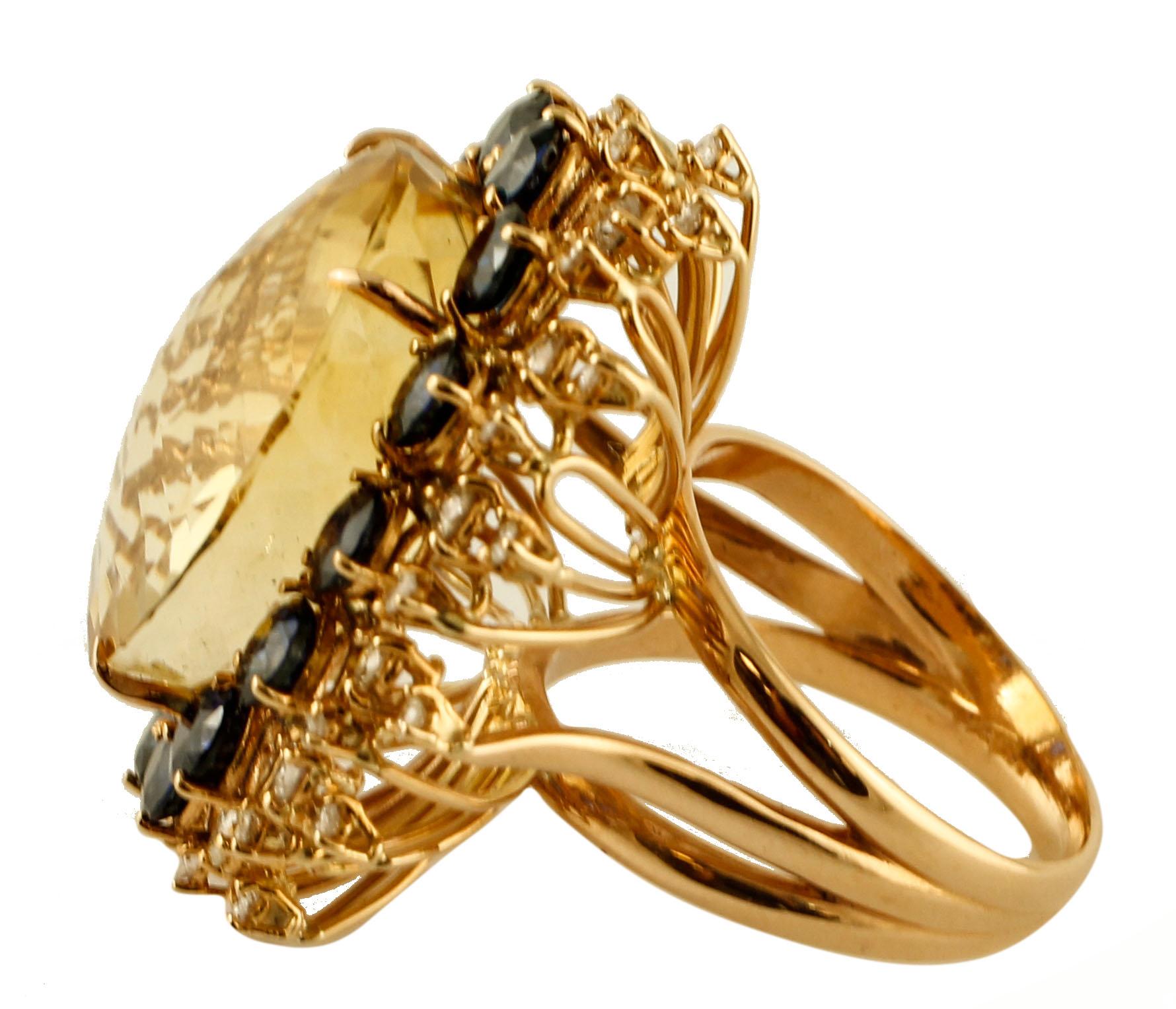 Elegant vintage ring in 18 kt rose gold structure, mounted with a big central round yellow topaz surrounded by a frame of intense blue sapphires and diamonds.
This ring is totally handmade by Italian master goldsmiths.
Diamonds 1.14 ct
Blue