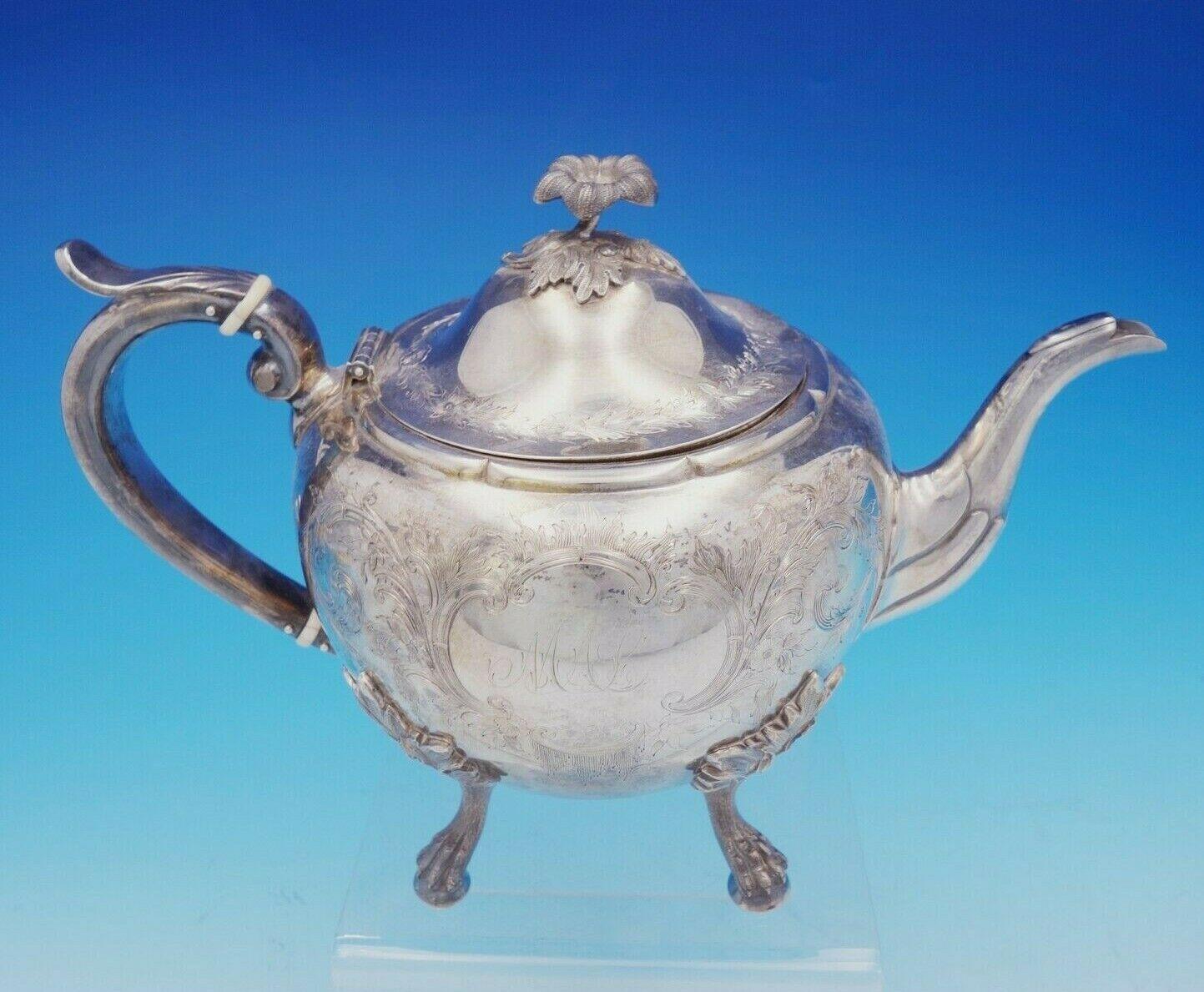 Bigelow Kennard

Elegant Bigelow Kennard coin silver 5-piece tea set circa 1845-63, made in Boston. It features bright-cut scrollwork with flowers, applied leaf and lion paw with ball feet, and 3-D flower finials. This set includes:

2 - Tea pot: