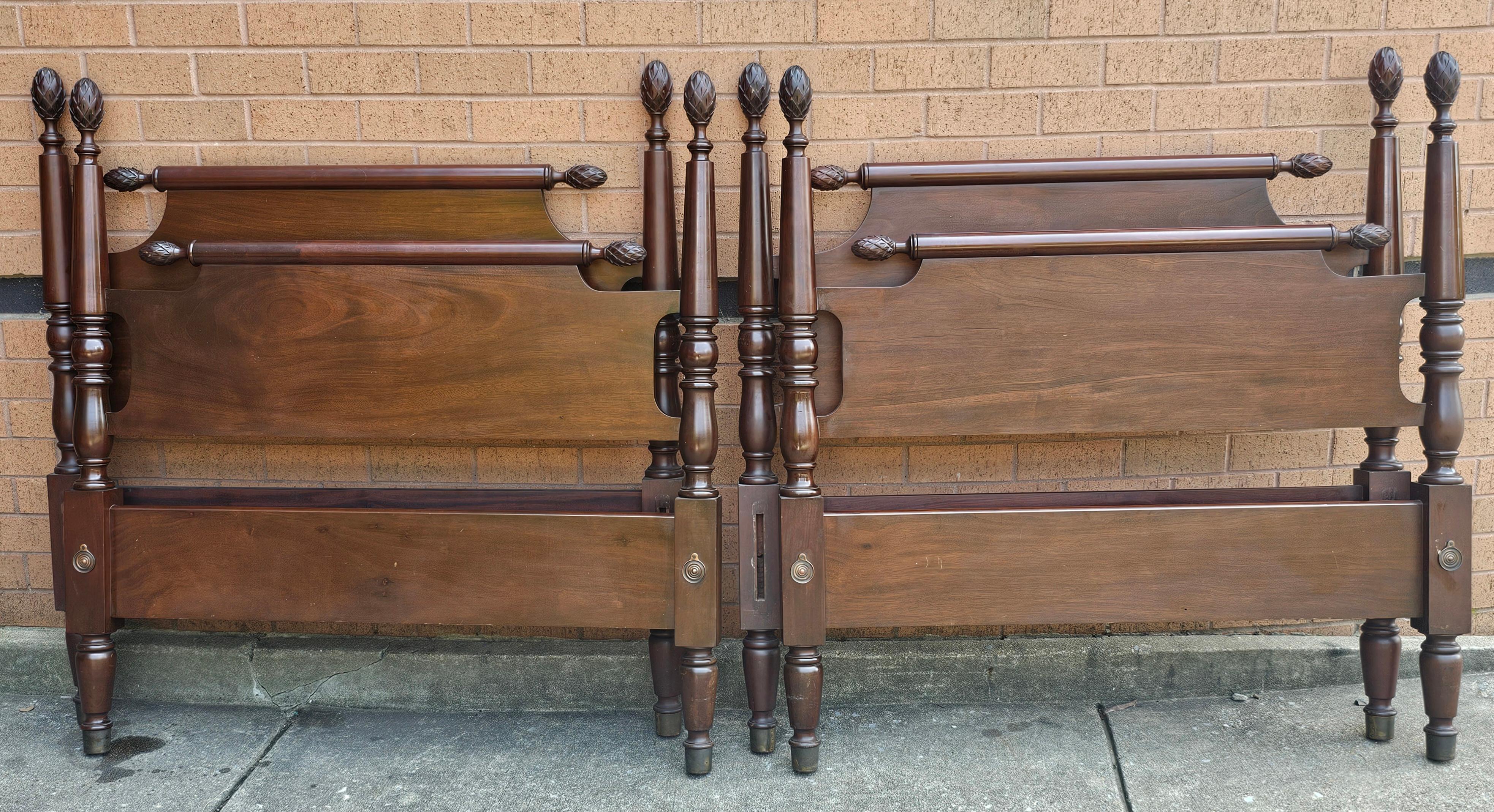 A pair of Biggs Virginia Furniture Mahogany Pineapple 3/4 Twin Beds, Pair. Include in listing are a pair of Headboards, a pair of Footboards. Finish on all sides. The bolt-on bedrails are not present and not included.