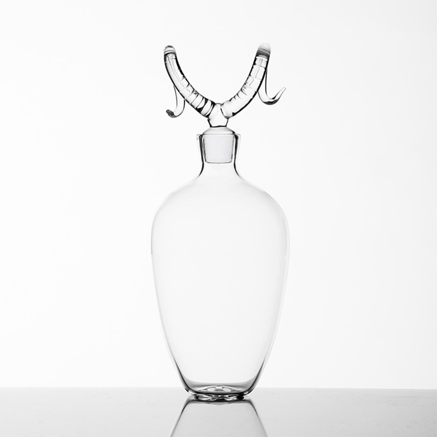 'Bighorn Bottle'
A Hand Blown Glass Bottle by Simone Crestani
Bighorn Bottle is one of the pieces from the Trophy Bottles.

AA collection of bottles with linear shapes that reserve a surprise at the top. Elk, antelope, deer or buffalo? Each trophy