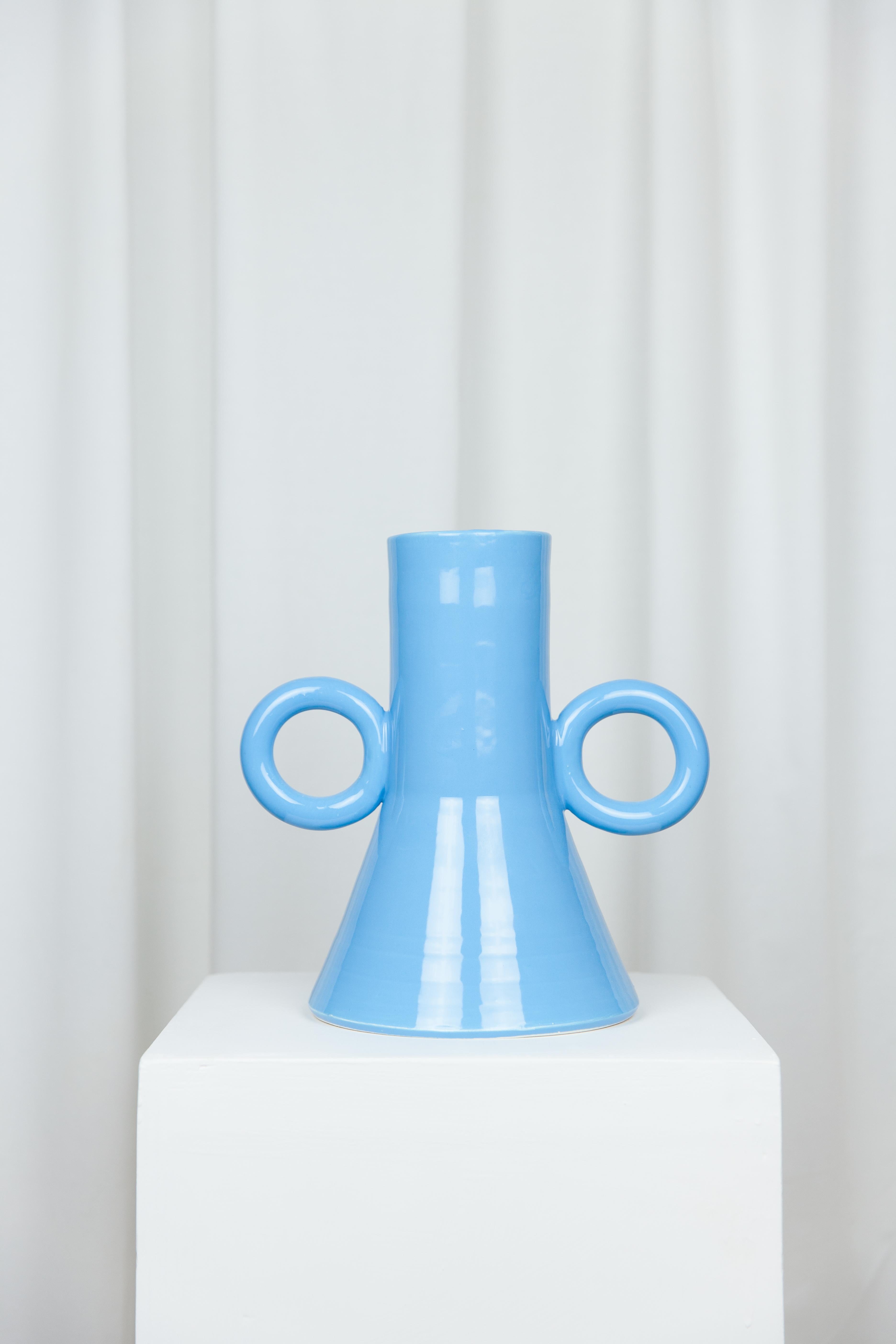 Bigloop vase by Lola Mayeras
Dimensions: D26 x W118 x W26 cm
Materials: Earthenware.

Vase in white earthenware, glazed in blue. This piece is designed and handcrafted in the south of France.

Lola Mayeras — Designer 
In parallel with her