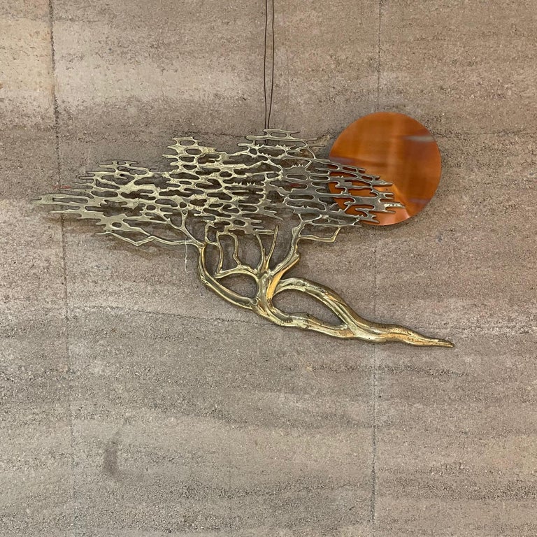 Warm bronze art work sculpture by late Master Sculptor Artist, BIJAN.
This sculpture was part of Bijan's Golden Bronze artistic period.
Sculpted bonsai tree with California sun in bronze.
Measures: 32 w x 17.5 tall x 2 D
Original unrestored