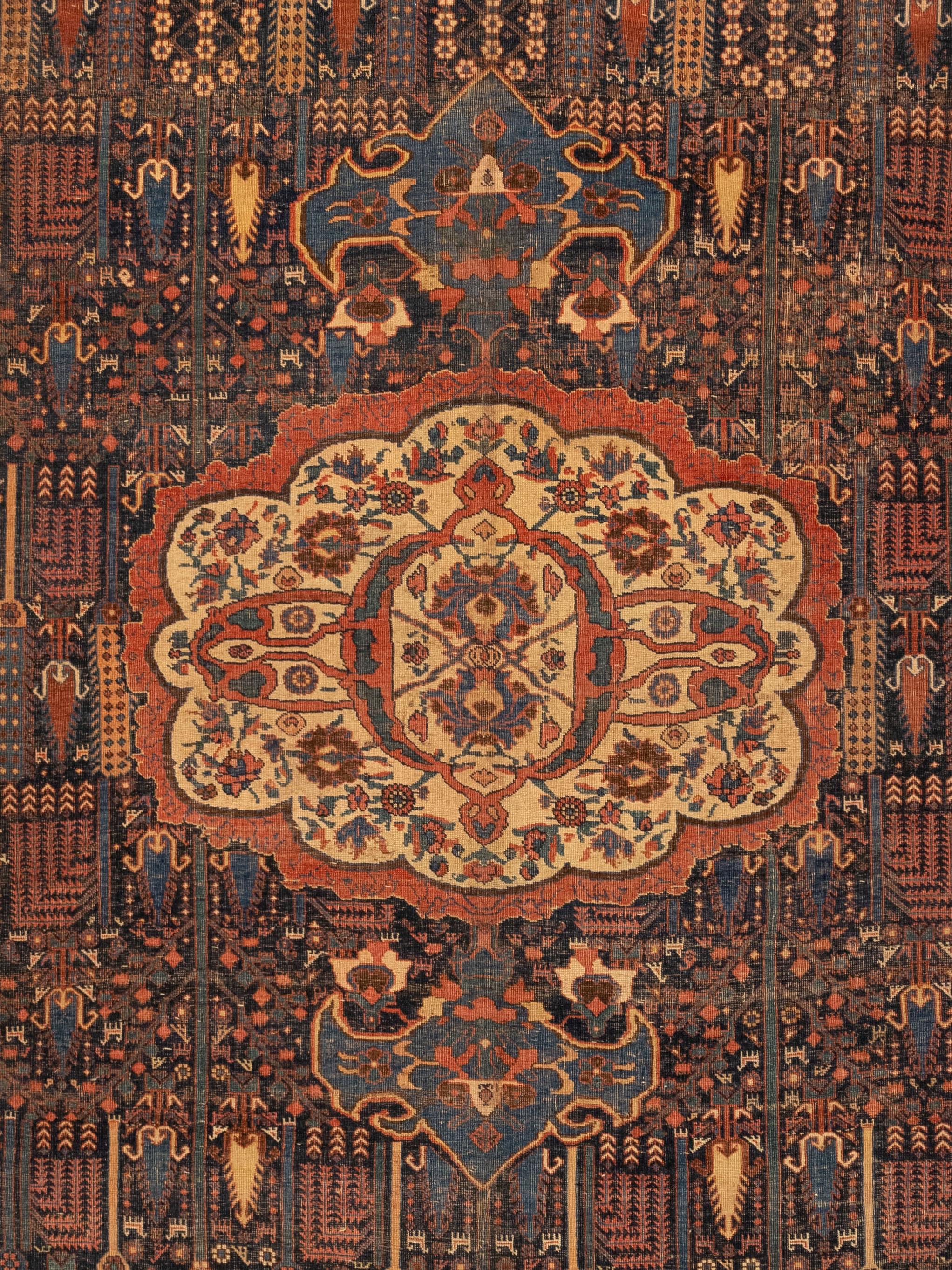 This is an antique Bijar rug. Bijar rugs get their name from a market center in Northwestern Iran by the name of Bijar. This market place has a long standing history of being a major weaving area, producing some of the most finely crafted rugs.
