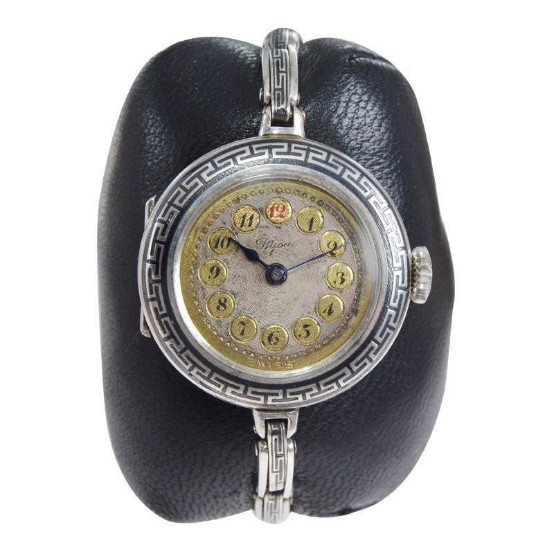 FACTORY / HOUSE: Racine Watch Company / Bijou
STYLE / REFERENCE: Art Deco / Bracelet Watch
METAL / MATERIAL: Silver with Inlaid Niello
CIRCA / YEAR: Mid Teens 
DIMENSIONS / SIZE: Diameter 27mm
MOVEMENT / CALIBER: Manual Winding / 15 Jewels 
DIAL /