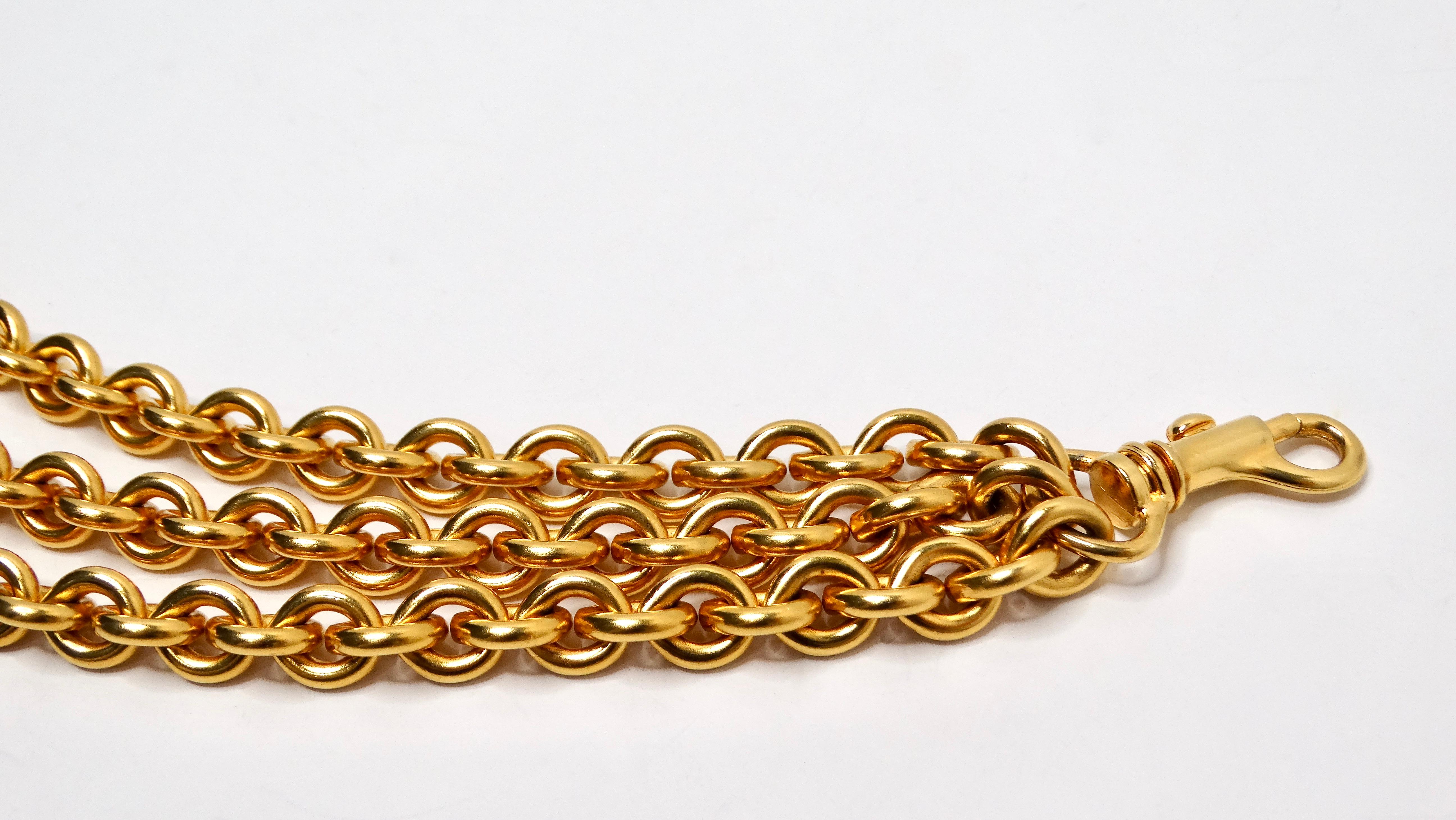 Introducing the Bijou Multi-Chain Gold-Tone Link Belt Charm, a versatile accessory that redefines chic and sophistication. With three elegant chains adorned with shimmering gold-tone links, this charm adds a touch of glamour to any outfit. The