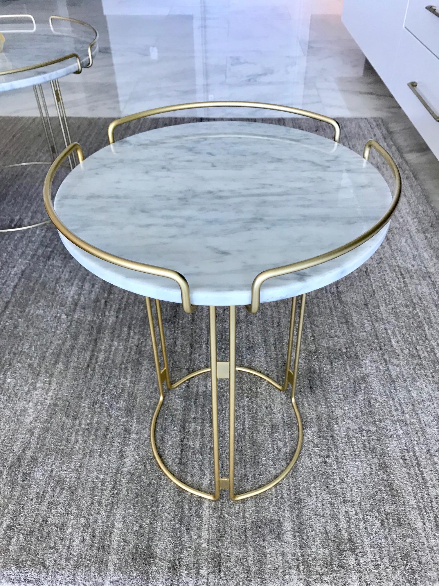 Stunning side table or drinks table designed by Fabrice Berrux for Roche Bobois. Table has a Mid-Century Modern inspired design. Features white Carrara marble top with round three-sided steel wire frame in lacquered matte gold or satin brass finish.