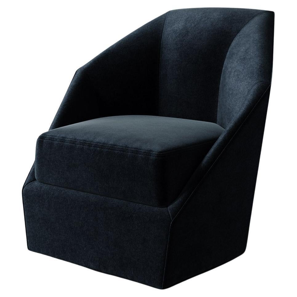 The Bijou Swivel Chair from Lemieux et Cie is a sculptural statement, its faceted lines and bold silhouette channeling the geometric drama of French Deco. A study in both precision and elegance, its angular form captures the spirit of the era’s