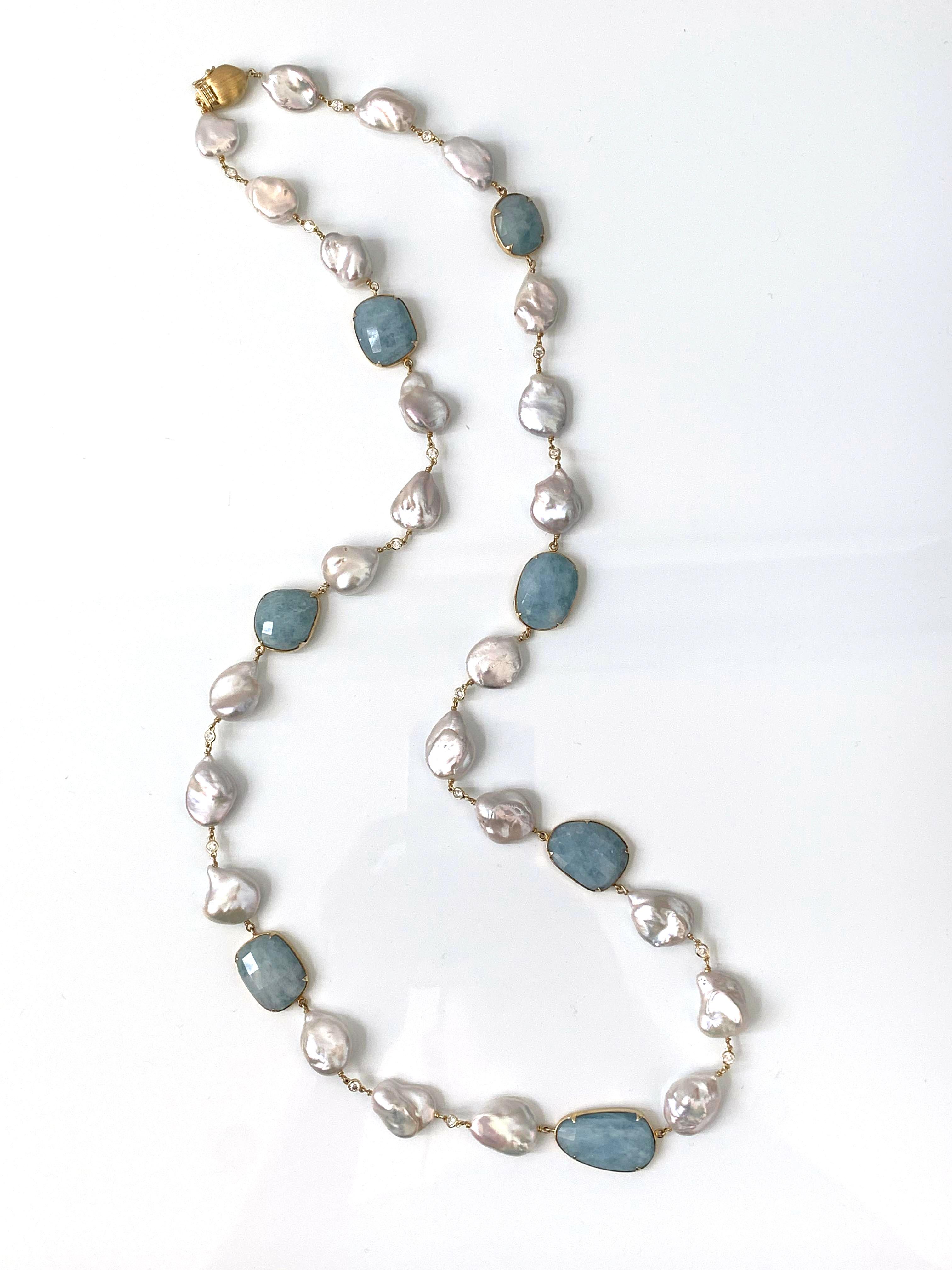 Beautiful Aquamarine and Fresh Water Baroque Pearl Necklace. 

The necklace features 7 unique fancy-shape milky aquamarines and 24 high-luster 15-18mm freshwater 