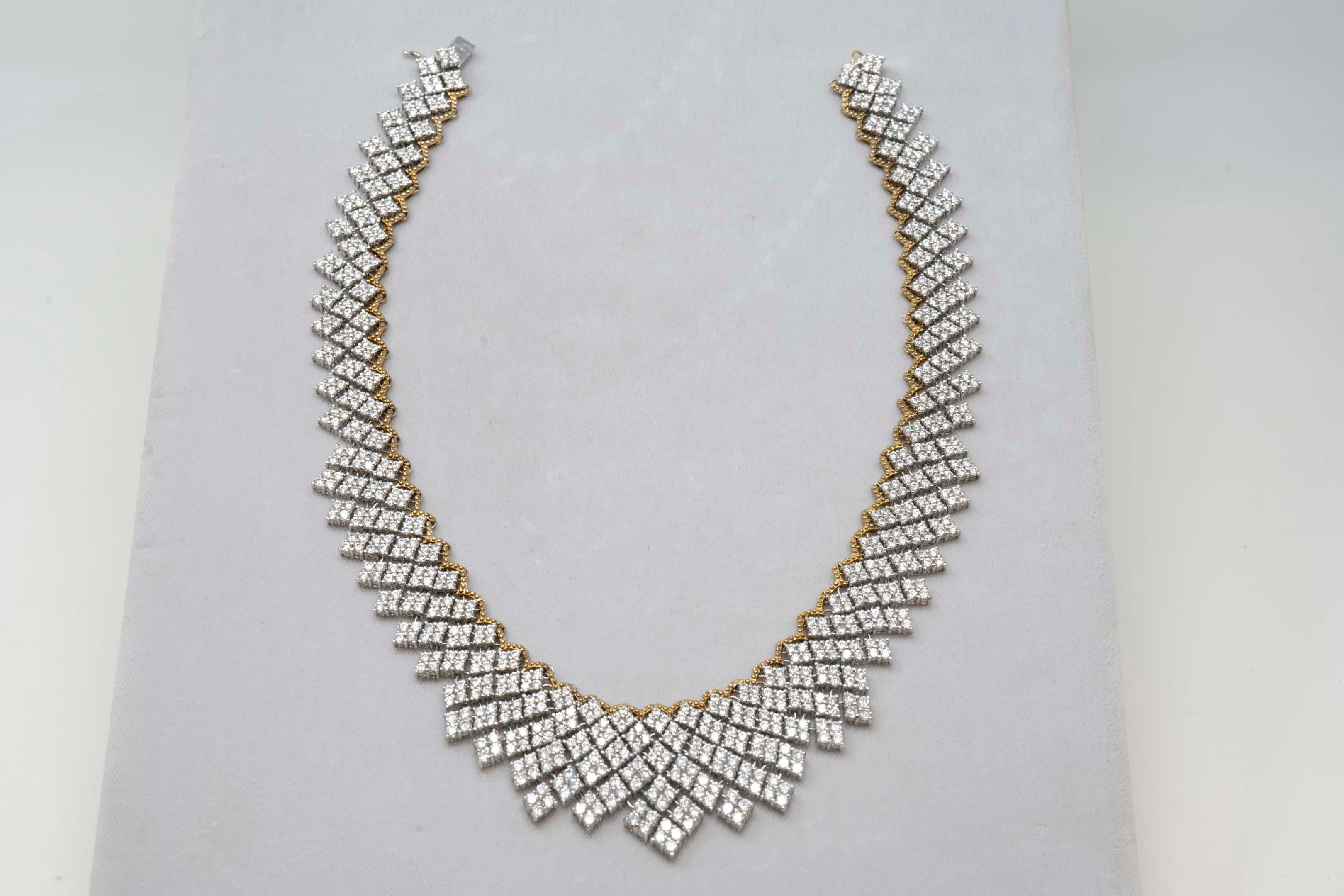 Modern Bijoux Num jewelry multilink bib sterling silver necklace with over 810 C/Z individually hand set in sterling silver. Showing a gold-plated line, stamped on the clasp 925,NUM. Measures 16 1/2 inches long x 1.5 inches wide.
