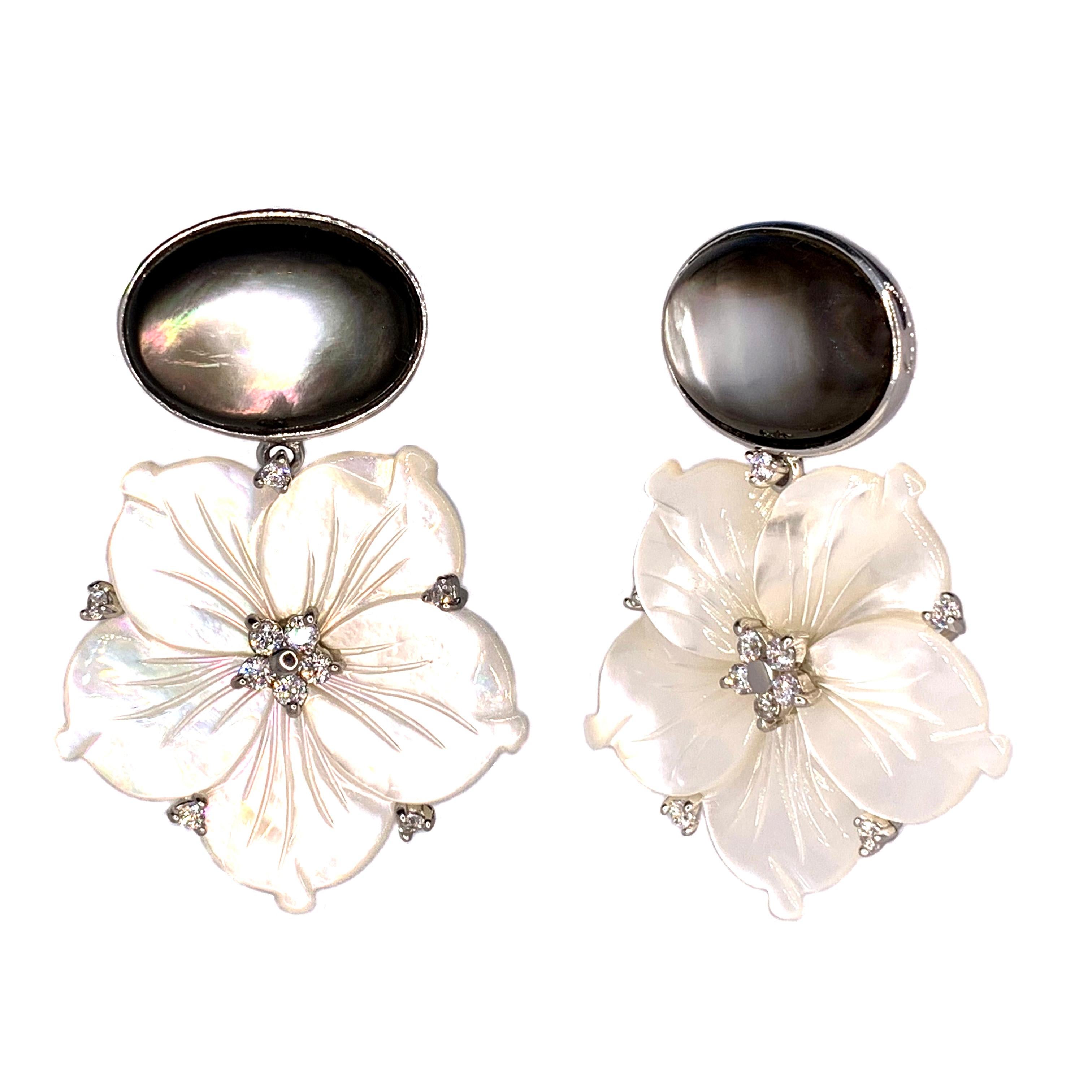 Stunning Oval Black Mother of Pearl and Carved Mother of Pearl Flower Drop Earrings

This gorgeous pair of earrings features genuine oval cabochon-cut black mother of pearl and beautifully carved white mother of pearl flower, adorned with round