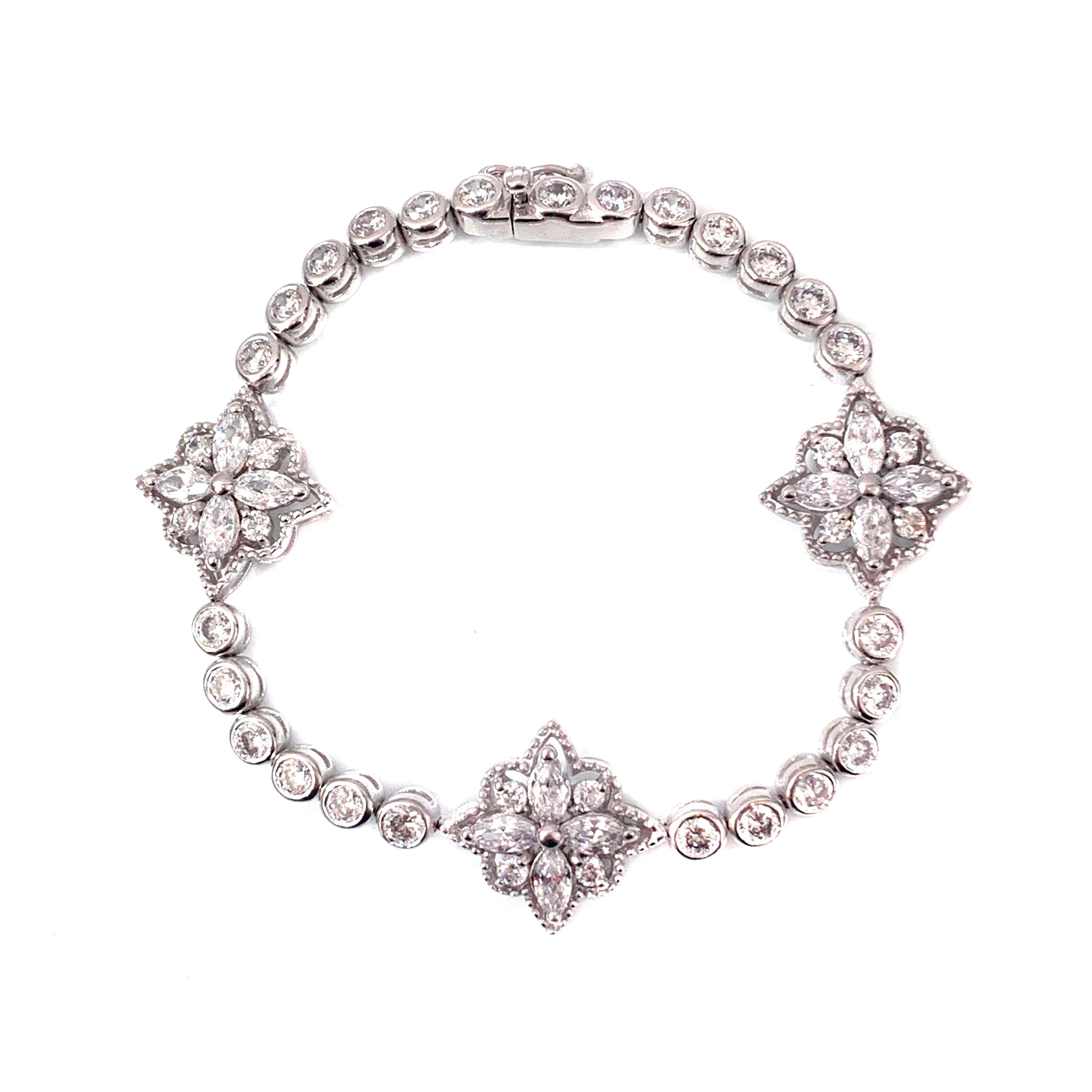 Bijoux Num Byzantine Flower Simulated Diamond Sterling Silver Bracelet

Beautiful bracelet featuring 3 byzantine flowers with etching design encrusted with marquis and round shape simulated diamonds, hand set and interconnected piece by piece, push