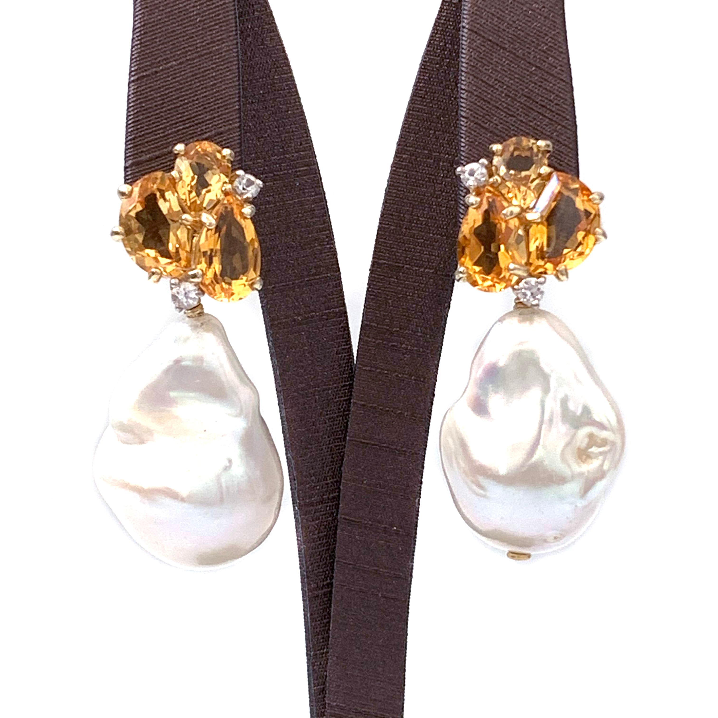 Bijoux Num Fancy-shape Citrine and Cultured Baroque Pearl Drop Earrings

These earrings feature cluster of genuine fancy-cut citrine, round white sapphire, and large cultured baroque pearl drop. The baroque pearls measured 17x25mm. Handset and wire