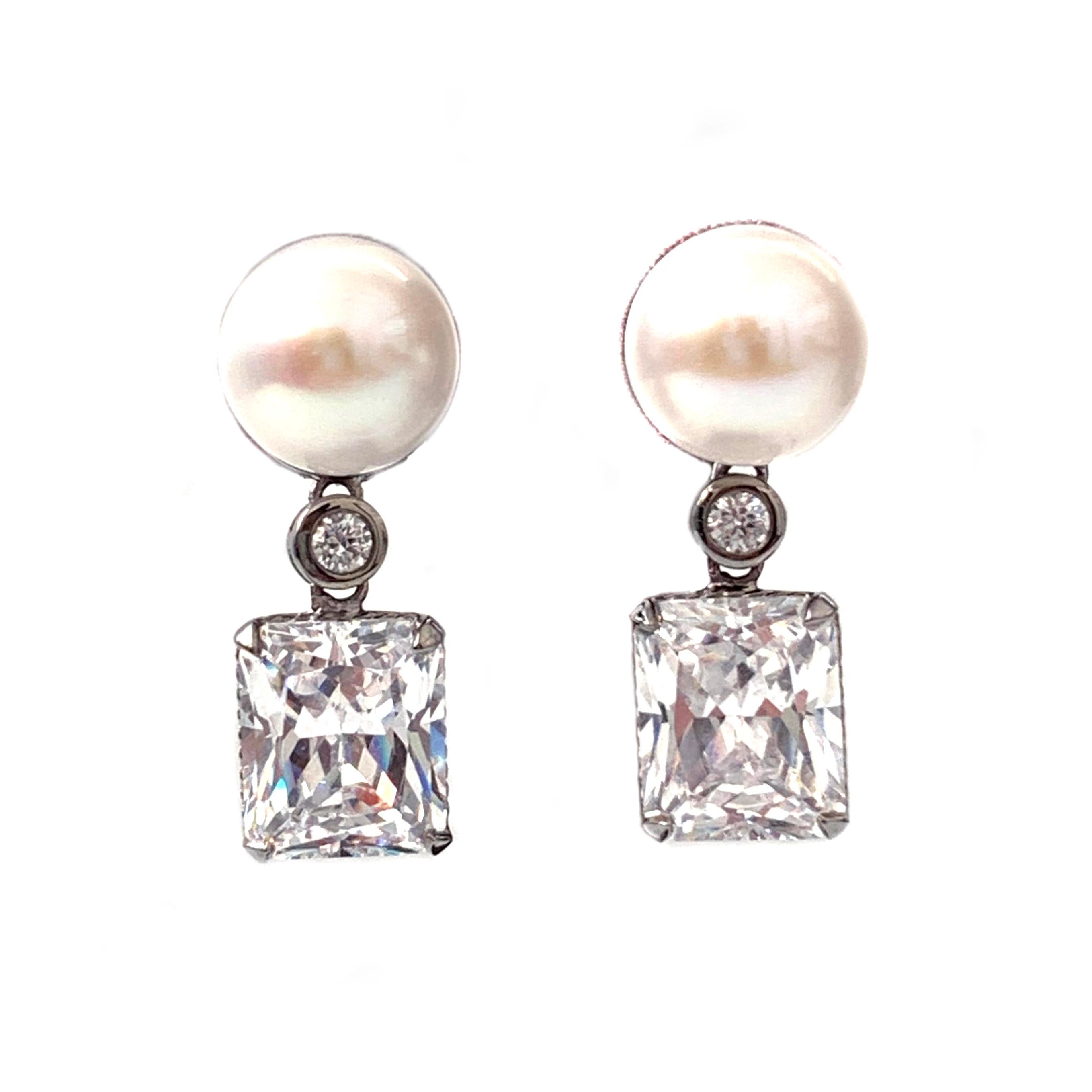 11mm Cultured Pearl and 4ct Simulated Diamond Drop Earrings

Stunning runway style earrings feature 11mm white cultured pearl and octagon simulated diamond (4 carat size), handcrafted in black rhodium plated sterling silver. The earrings give a lot