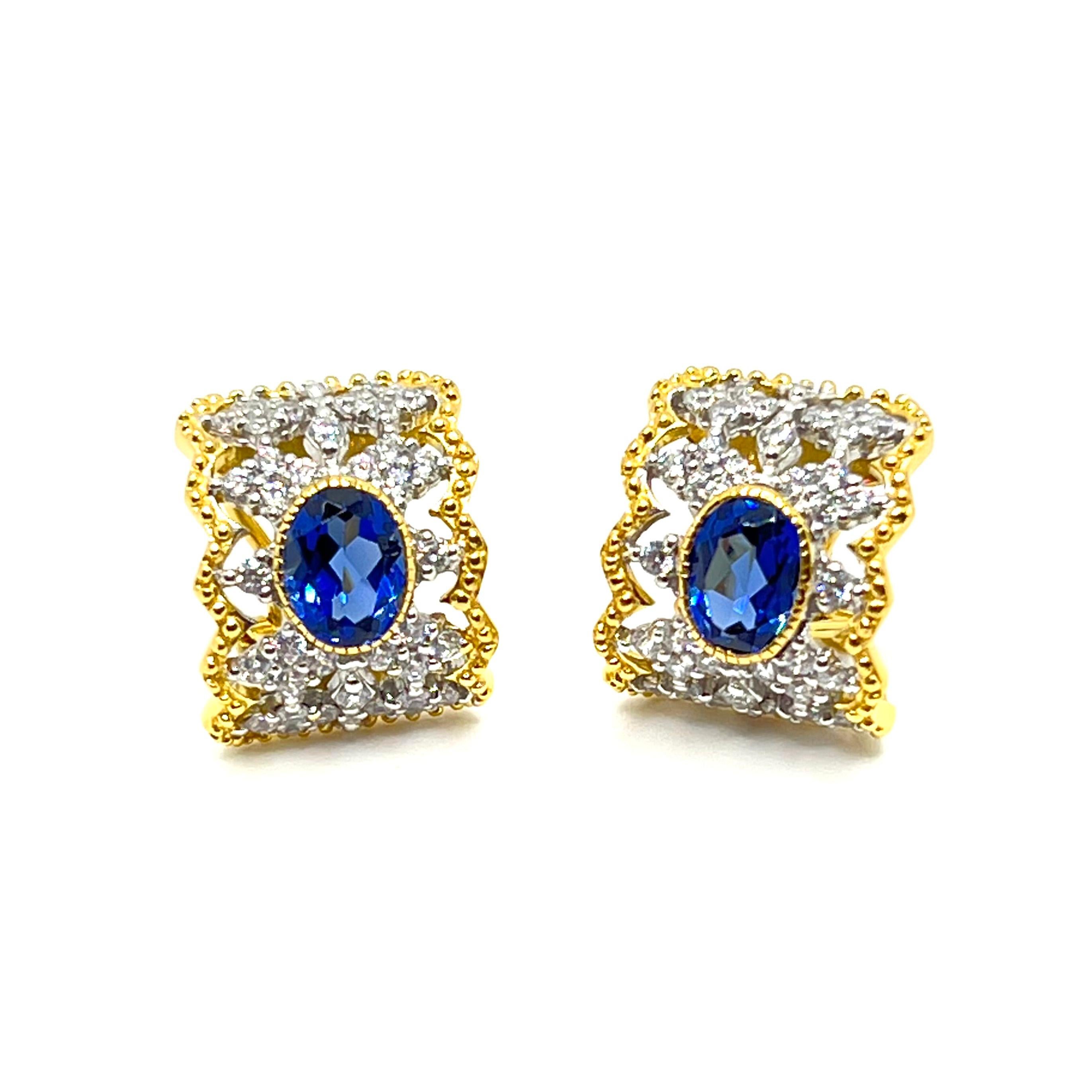 Stunning Bijoux Num Diamond-Pattern Oval Lab Sapphire Center Half Hoop Vermeil Earrings

These fabulous earrings feature a pair of beautiful oval lab-created blue sapphire (1.25ct size) and 76pcs of round simulated diamonds handset in two-tone