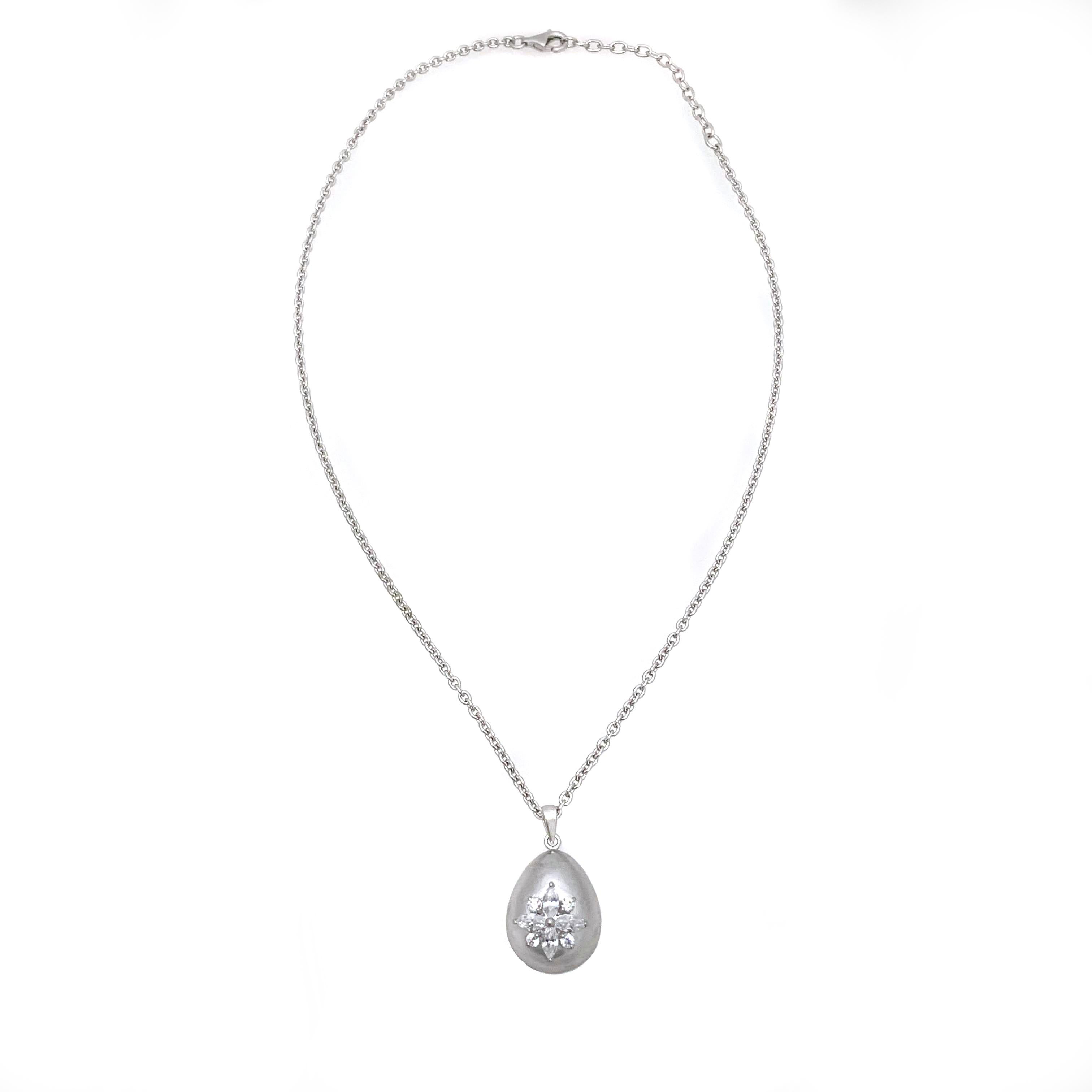 Beautiful egg-shape sterling silver pendant necklace handset with marquis-shape faux diamond cubic zirconia CZ. The pendant features handmade brush satin texturing technique on platinum rhodium plated sterling silver. The chain necklace is solid 3mm
