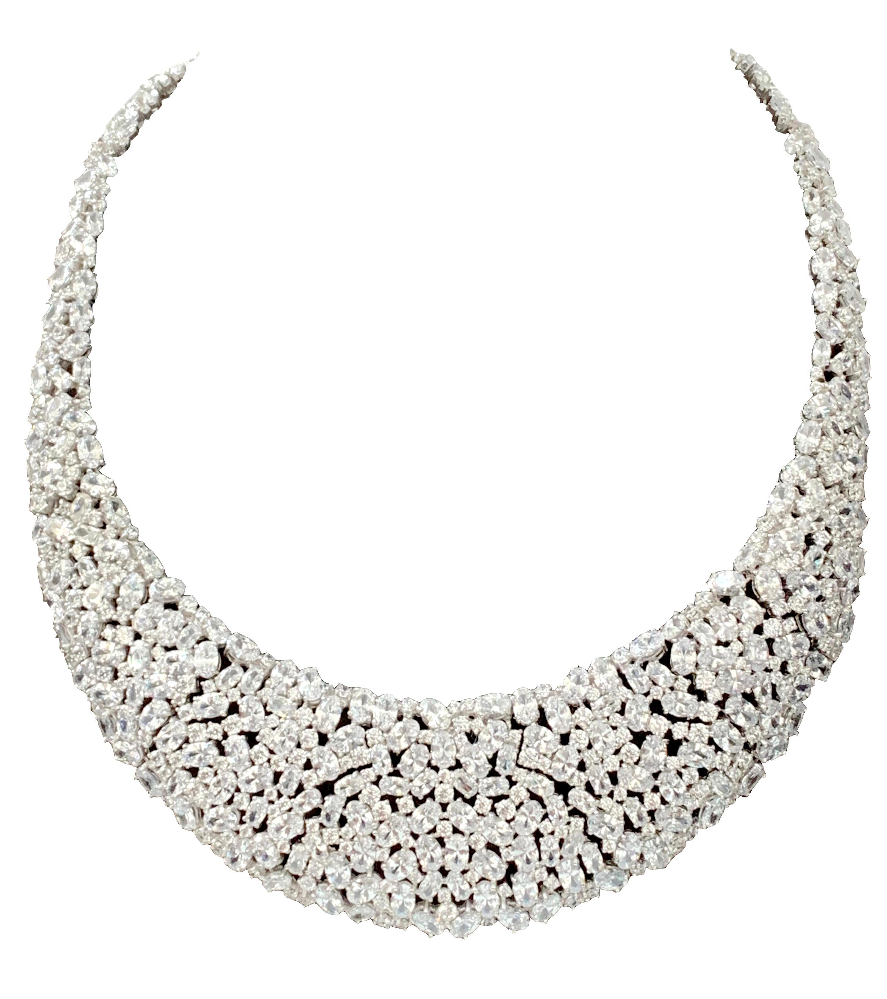 Elegant Clustered Cubic Zirconia Sterling Silver Bib Necklace. Over 500 pieces of Round and Pear Shaped Cubic Zirconia individually handset in platinum rhodium plated sterling silver. The bib is 1.5