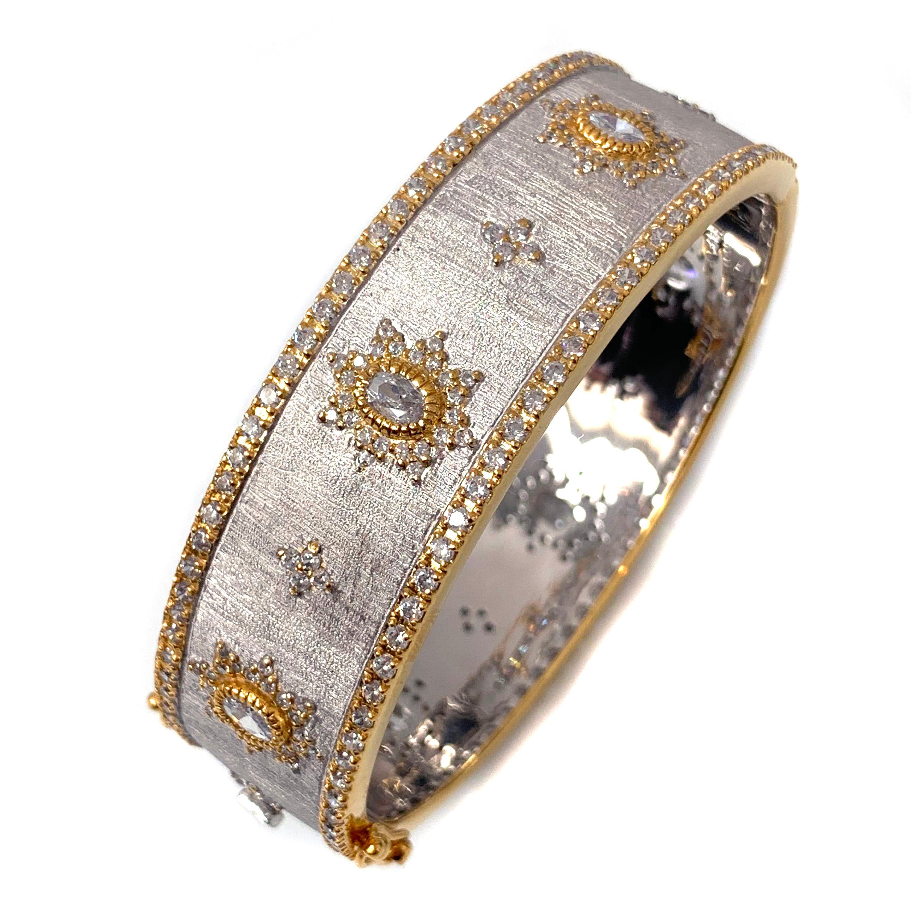 Bijoux Num hand-engraved star pattern two-tone bangle bracelet. 

This beautiful bracelet features over 340 pcs of oval and round simulated diamonds, handcrafted Italian 