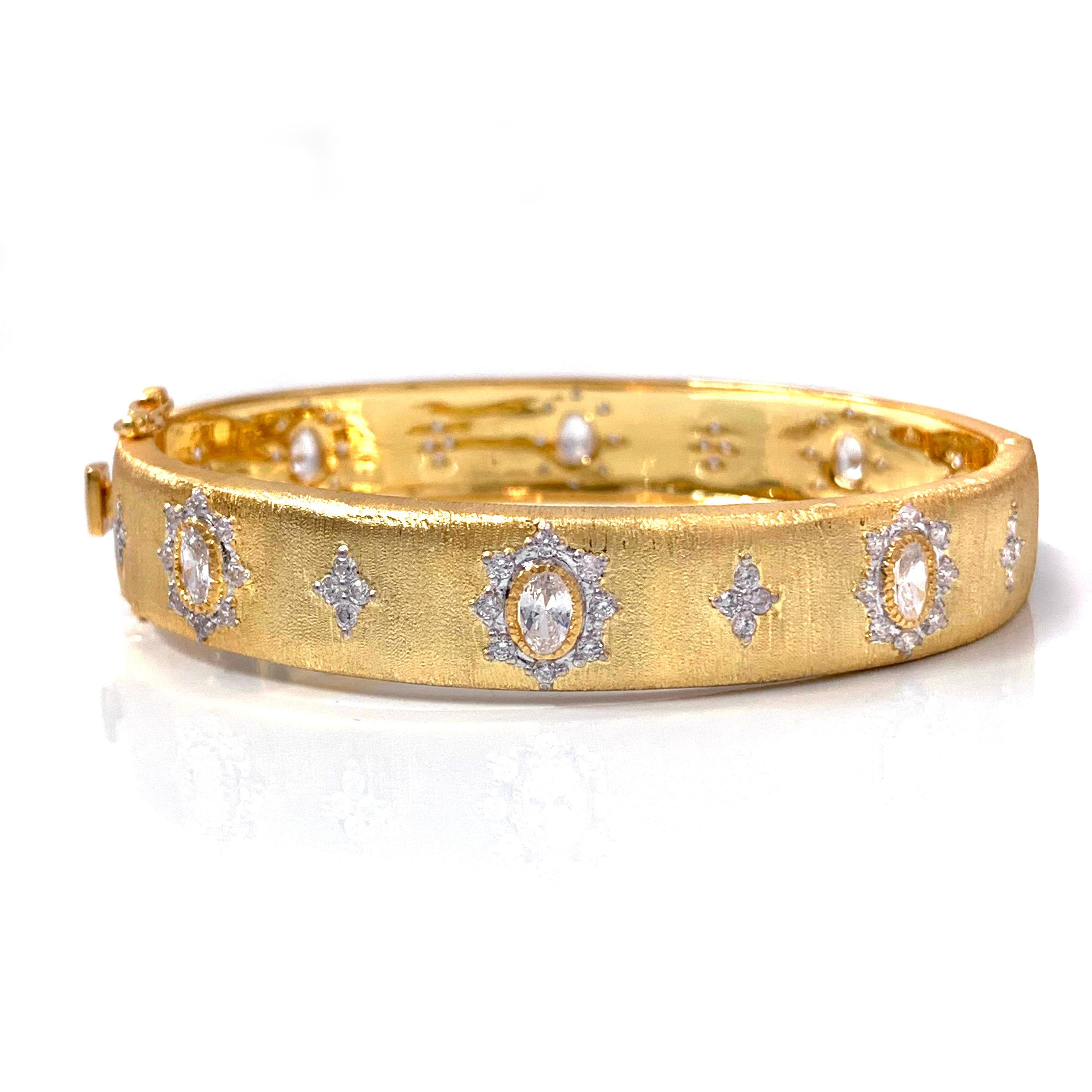 Bijoux Num hand-engraved star pattern vermeil bangle bracelet. 

This beautiful bracelet features over 80 pcs of oval and round simulated diamonds, handcrafted Italian 