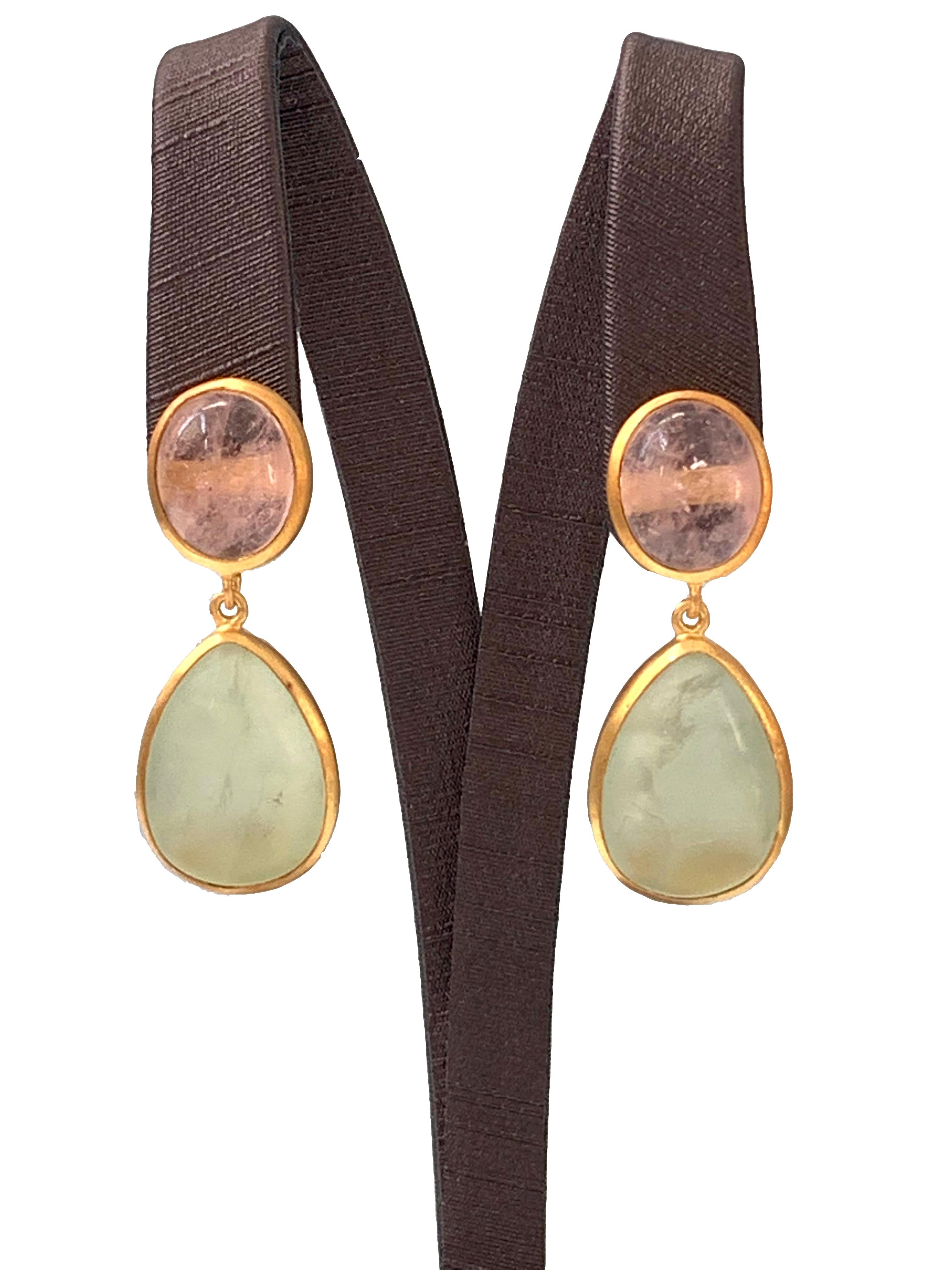 Discover these oval Morganite and pear-shape Prehnite Drop Earrings.  

The earrings feature glowing pastel pink cabochon-cut oval Morganite and vitreous green cabochon-cut pear shape Prehnite, handcrafted brushed satin texturing technique, and hand