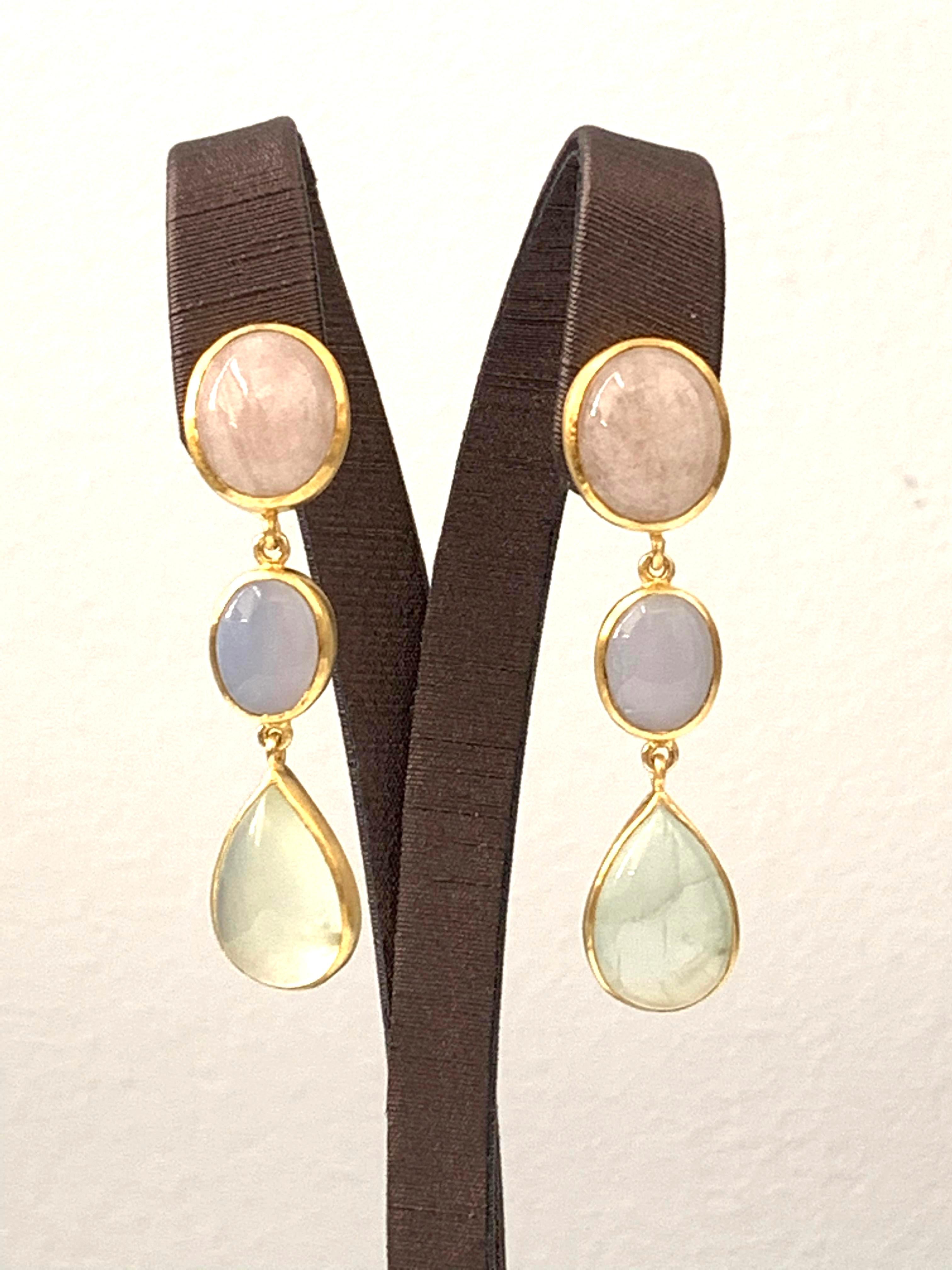 Discover this Oval Morganite, Oval Chalcedony and Pear Prehnite Vermeil Dangle Earrings. All in Cabochon cut. Hand set in 18k gold plated sterling silver. Straight post with large earrings back for comfort and safety. 2