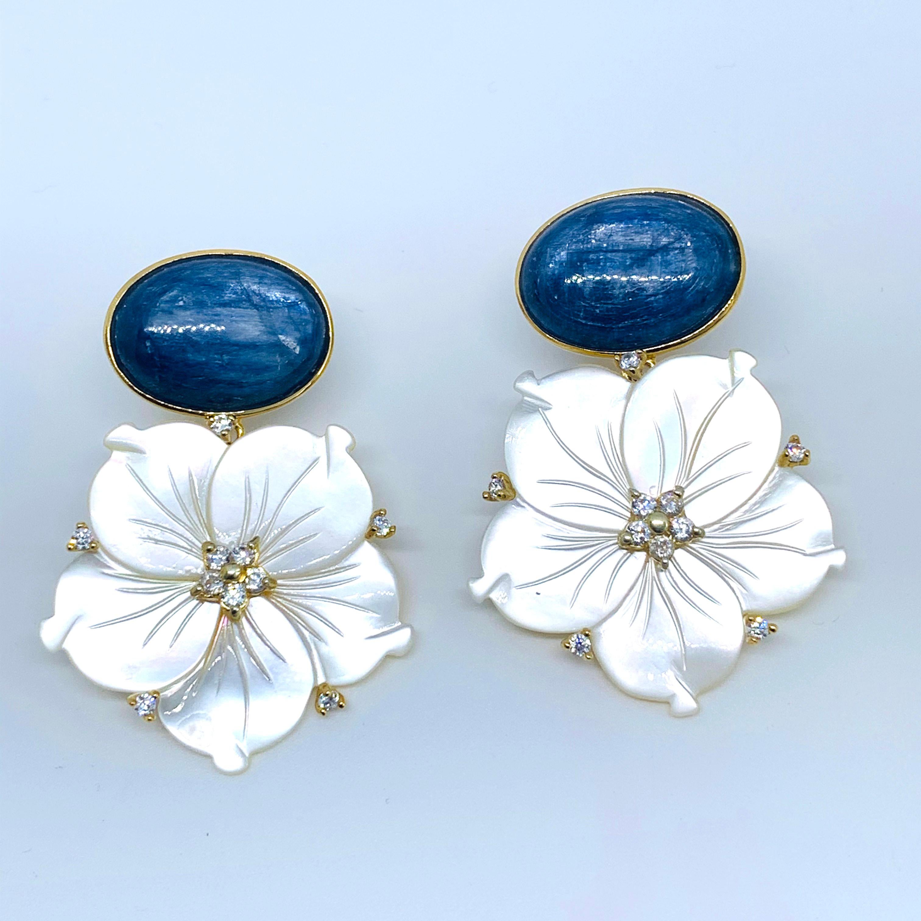 Stunning Oval Kyanite and Carved Mother of Pearl Flower Drop Vermeil Earrings

This gorgeous pair of earrings features genuine oval cabochon-cut blue kyanite and beautifully carved mother of pearl flower, adorned with round simulated diamond,