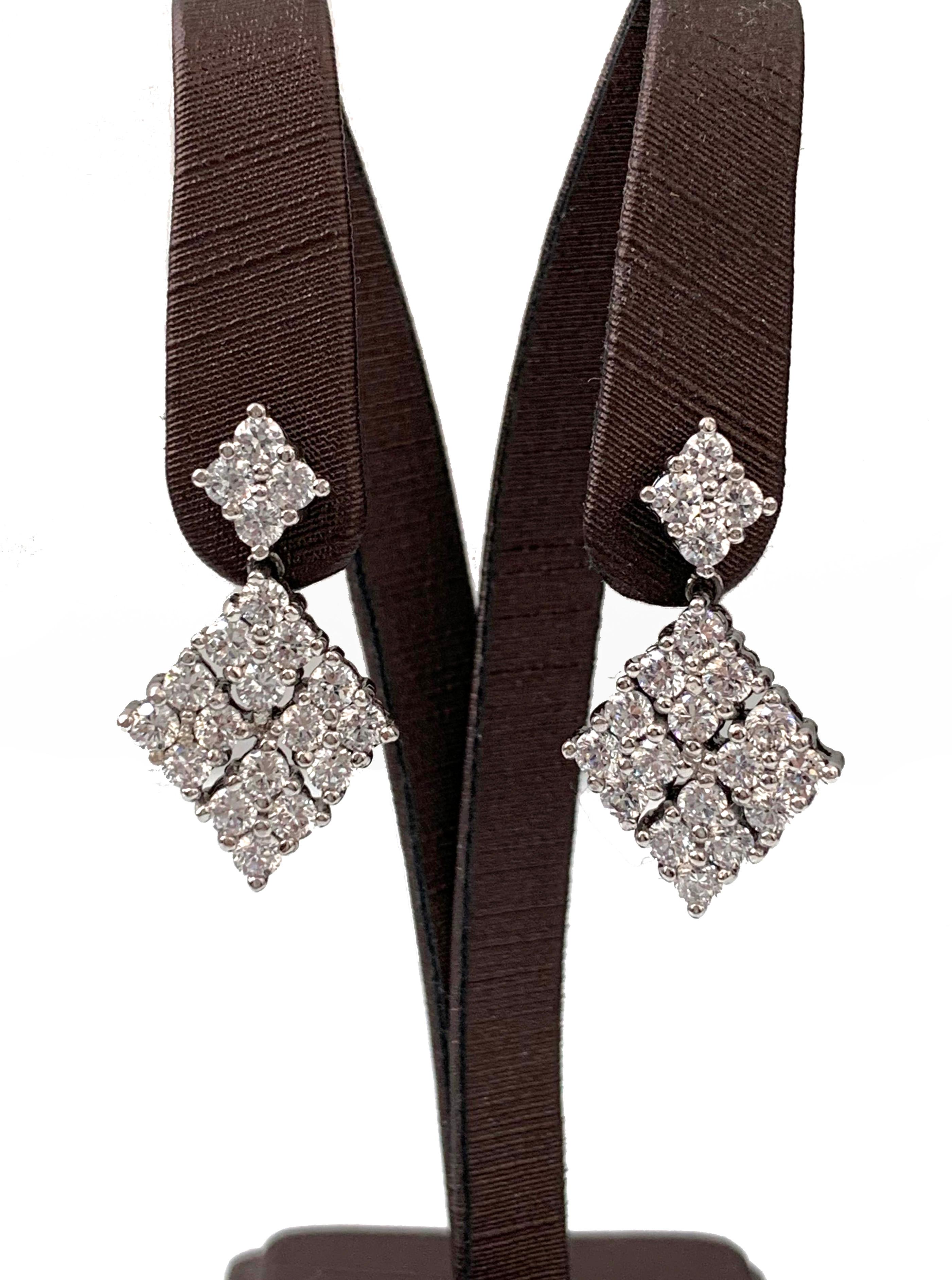 Small diamond shape cubic zirconia dangle earrings.  Top part is 0.25