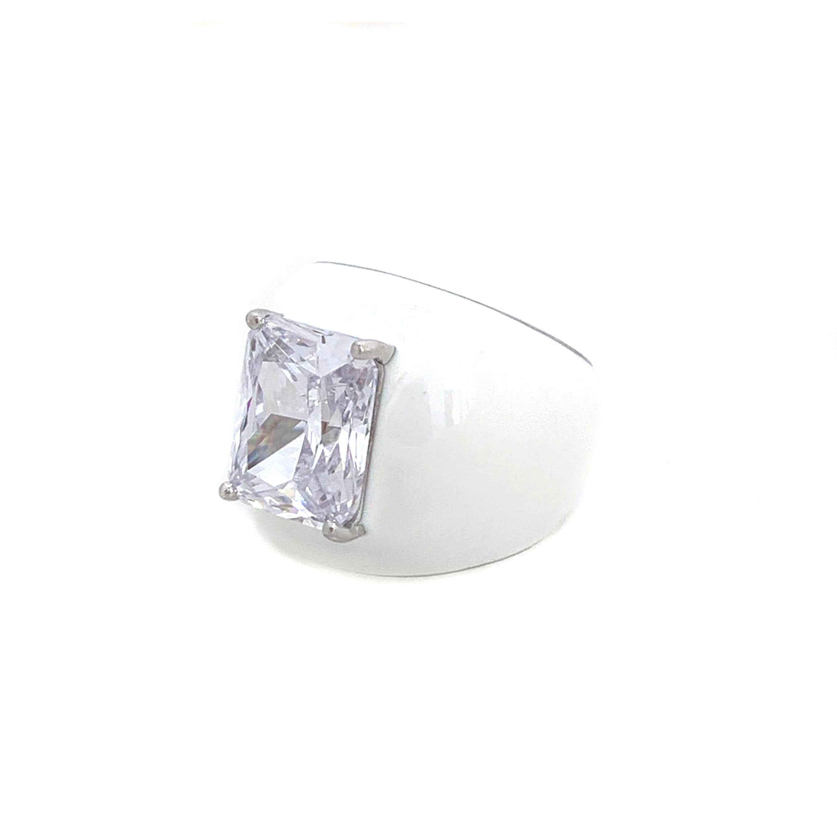 Bijoux Num Faux Diamond White Enamel Bombe Dome Ring

This bold cocktail ring features beautiful top quality 6ct radiant-cut faux diamond cubic zirconia, handset in platinum rhodium plated sterling silver. The entire ring is sheathed in shiny white