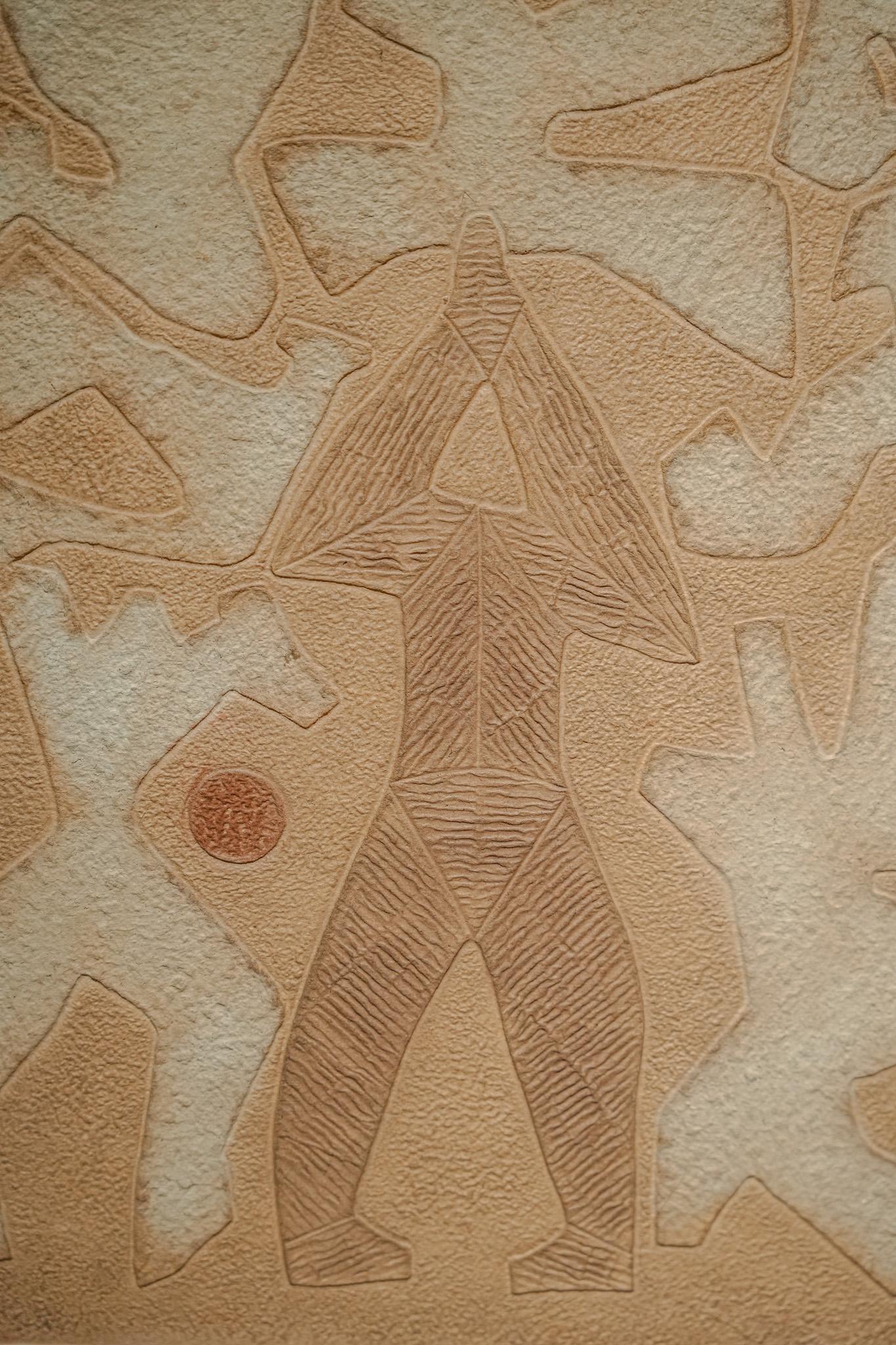 Cultivating the Mind by Bik Chuen Ha features an abstract human figure and symbolic text arranged in harmonious balance. At the center, a dark brown figure with hands joined in prayer or meditation exudes a sense of inner calm, surrounded by