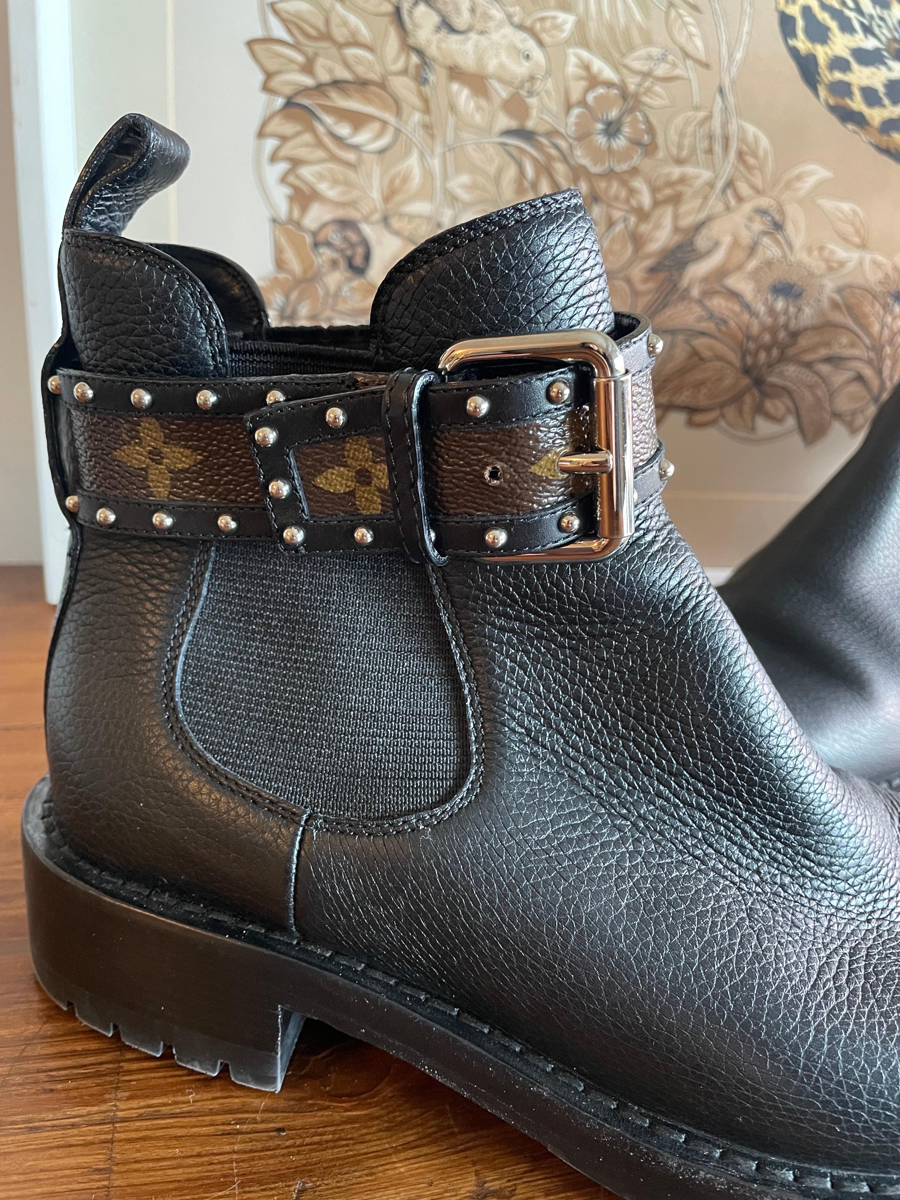Louis Vuitton leather bikers with Monogram strap and studs on the ankle. Number 37.5 heel 3.5 cm. 
They show some signs of use but nothing serious to report. 