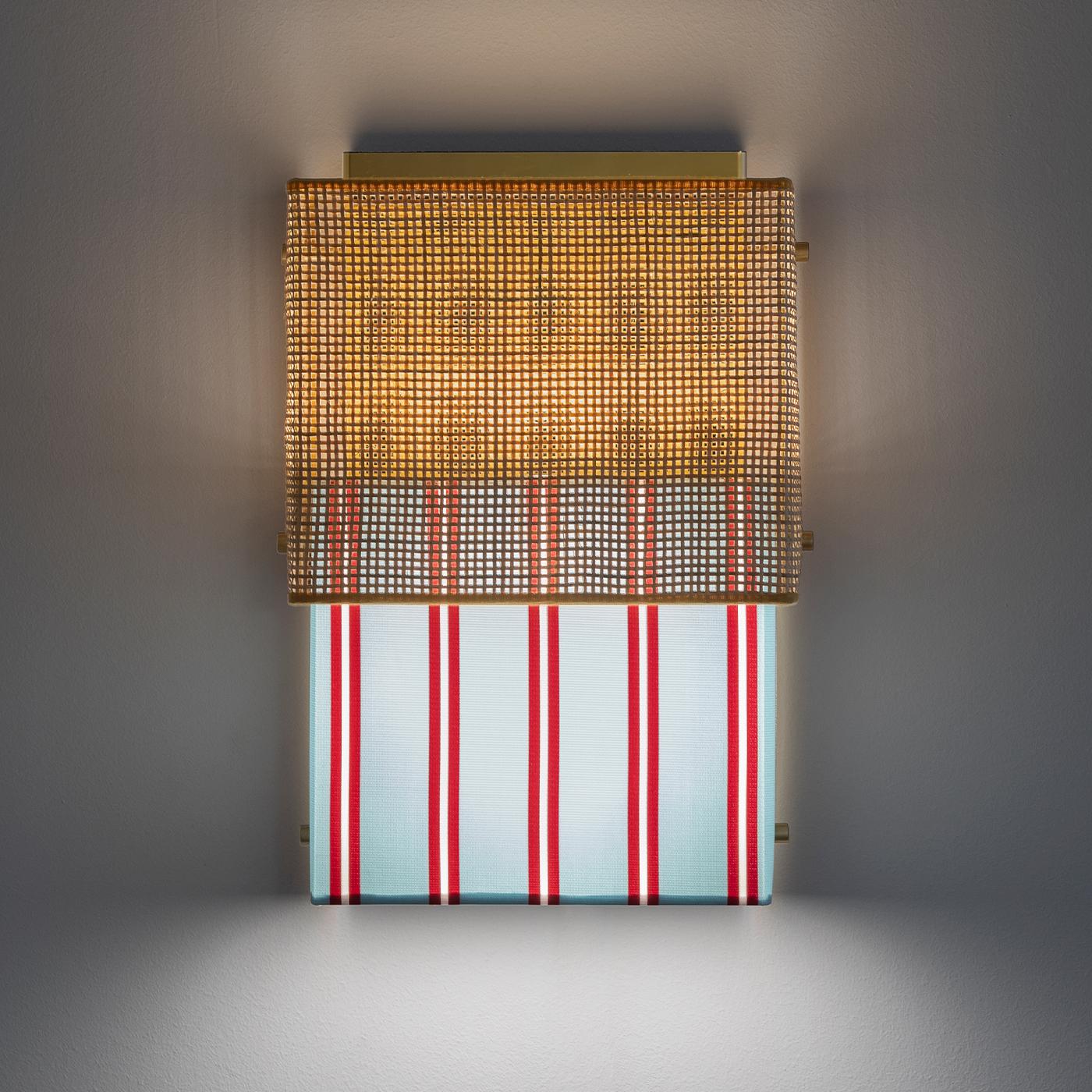This elegant, whimsical wall lamp is made from a surprising combination of contrasting textures and textiles. A rough rattan surface sits above smooth Trevira fabric in light-blue, red and white stripes. This two-piece design was inspired by the