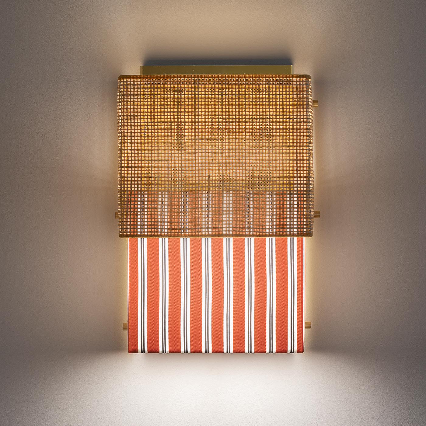 One of the most iconic designs of the 20th century is the bikini; this famous style inspired this mounted wall lamp made from two pieces of fabric. An upper part in rattan sits above rust-colored, striped Trevira fabric from the Milan-based textiles