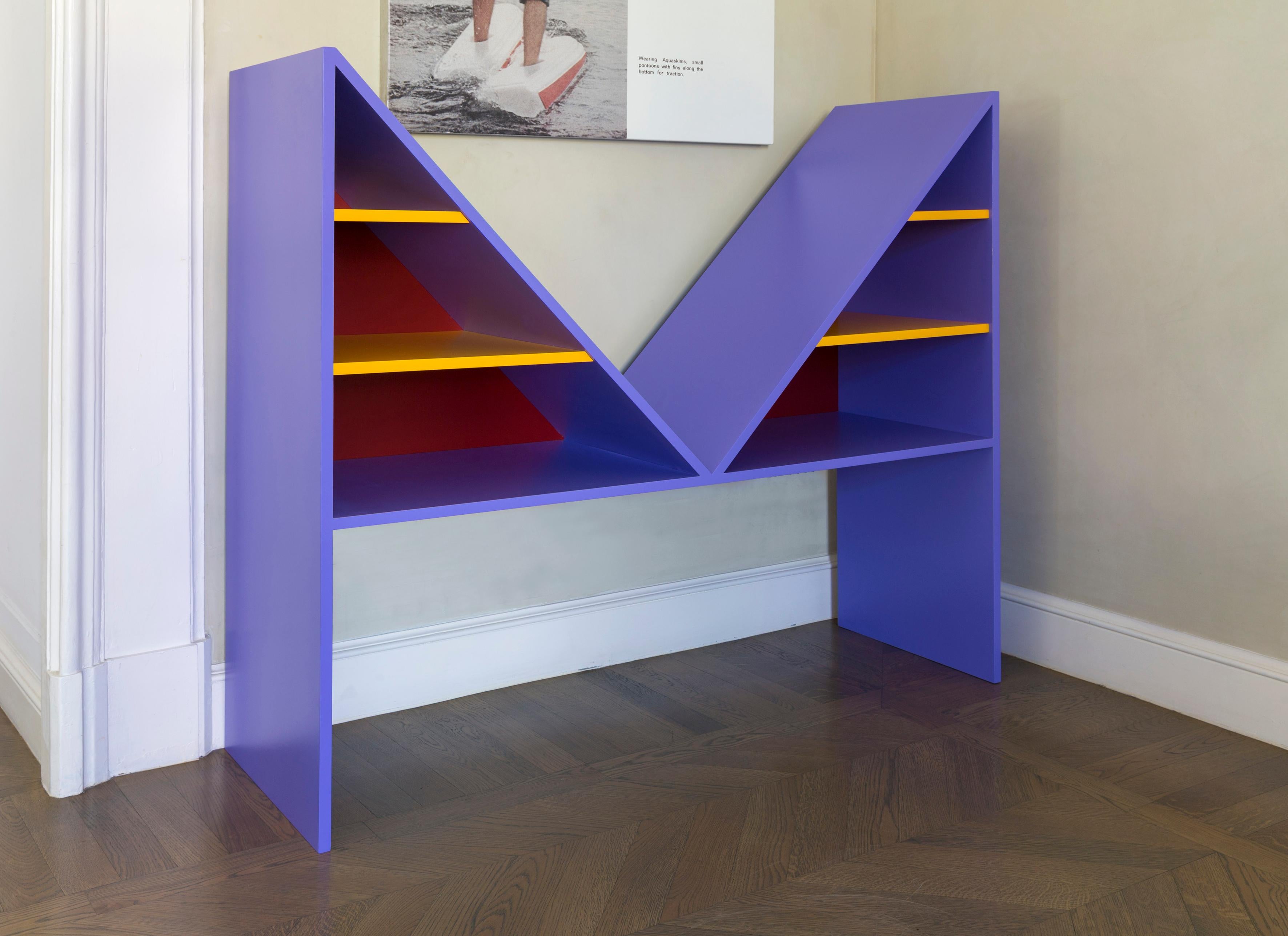 Bikini is a sculptural bookcase entirely composed by wood with intense colors and is an homage to the French designer Louis Rèard for having revolutionized the women's summer. 

Colors black, white and purple.

 