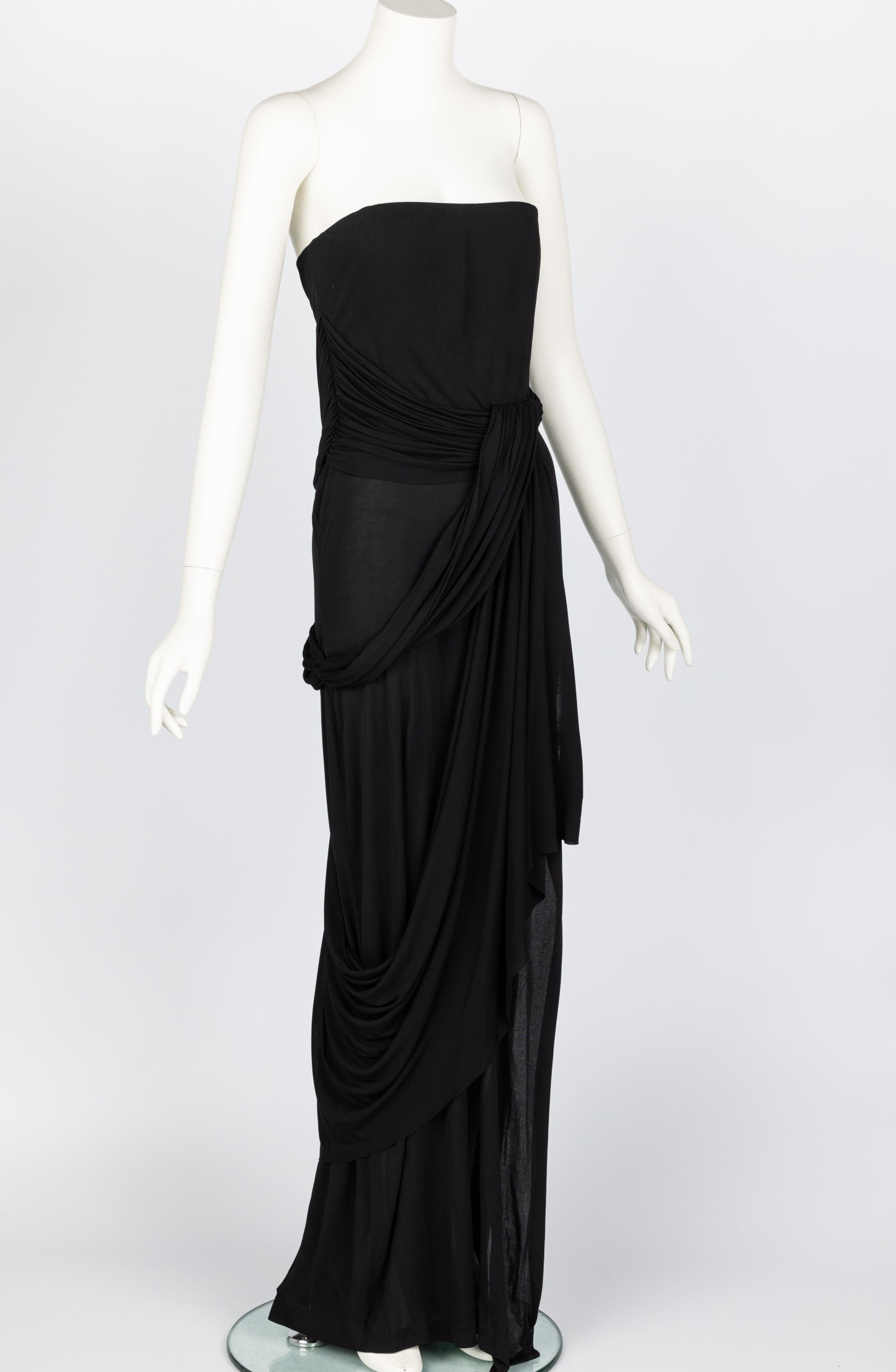 1970s Bill Blass for Bergdorf Goodman evening gown.

Done in an exquisite black fabric, that drapes beautifully. 
The bodice is boned.
concealed back zip closure.
Excellent condition, tiny mark on the bust.

No size label, please see