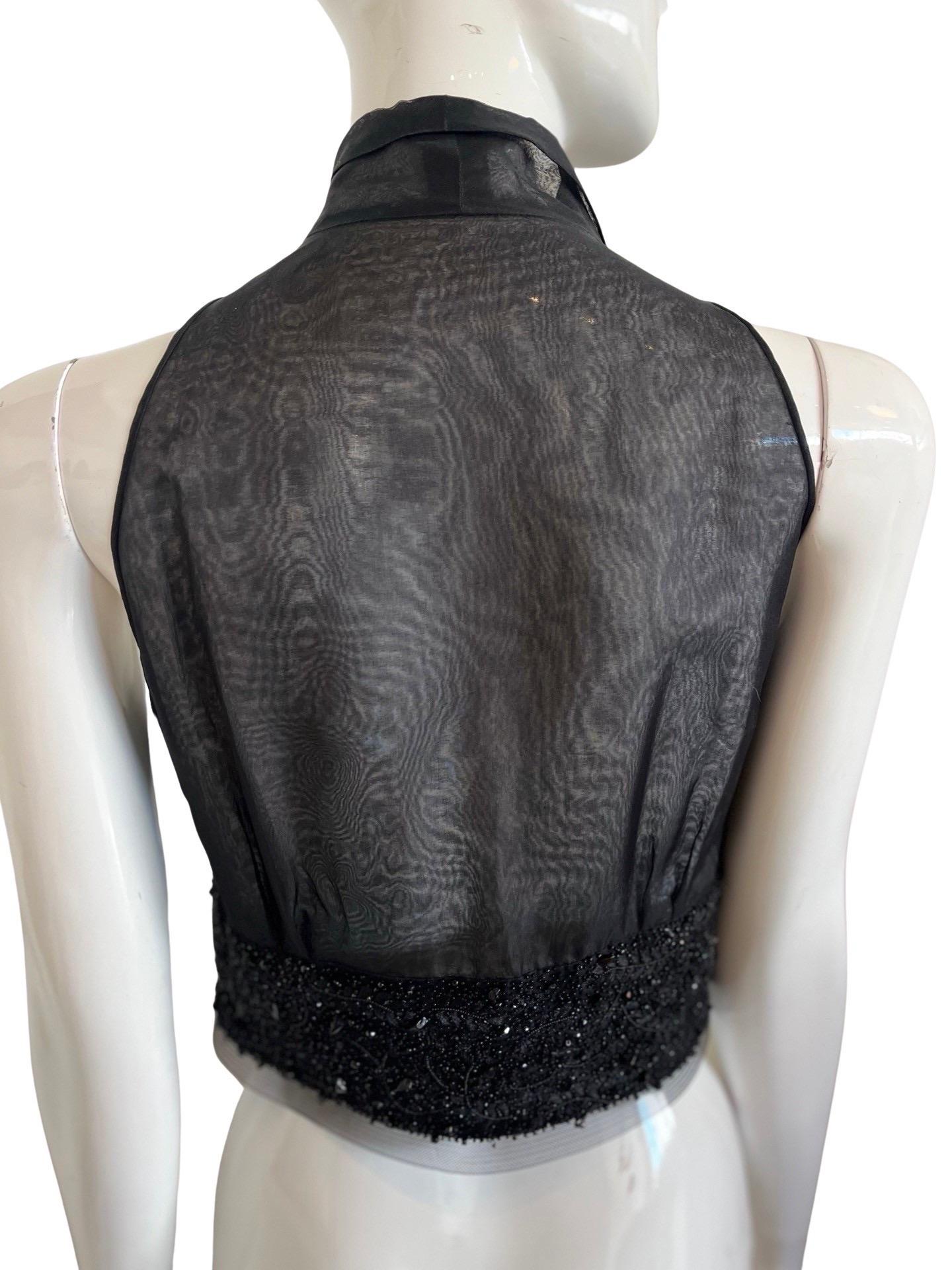 Incredible Bill Blass sheer organza waistcoat with organza collar and bust and a heavily beaded and embroidered waist band.  The waist buttons with 9 buttons and there is a heavy mesh trim at the bottom.  Could be worn over a button down or on its