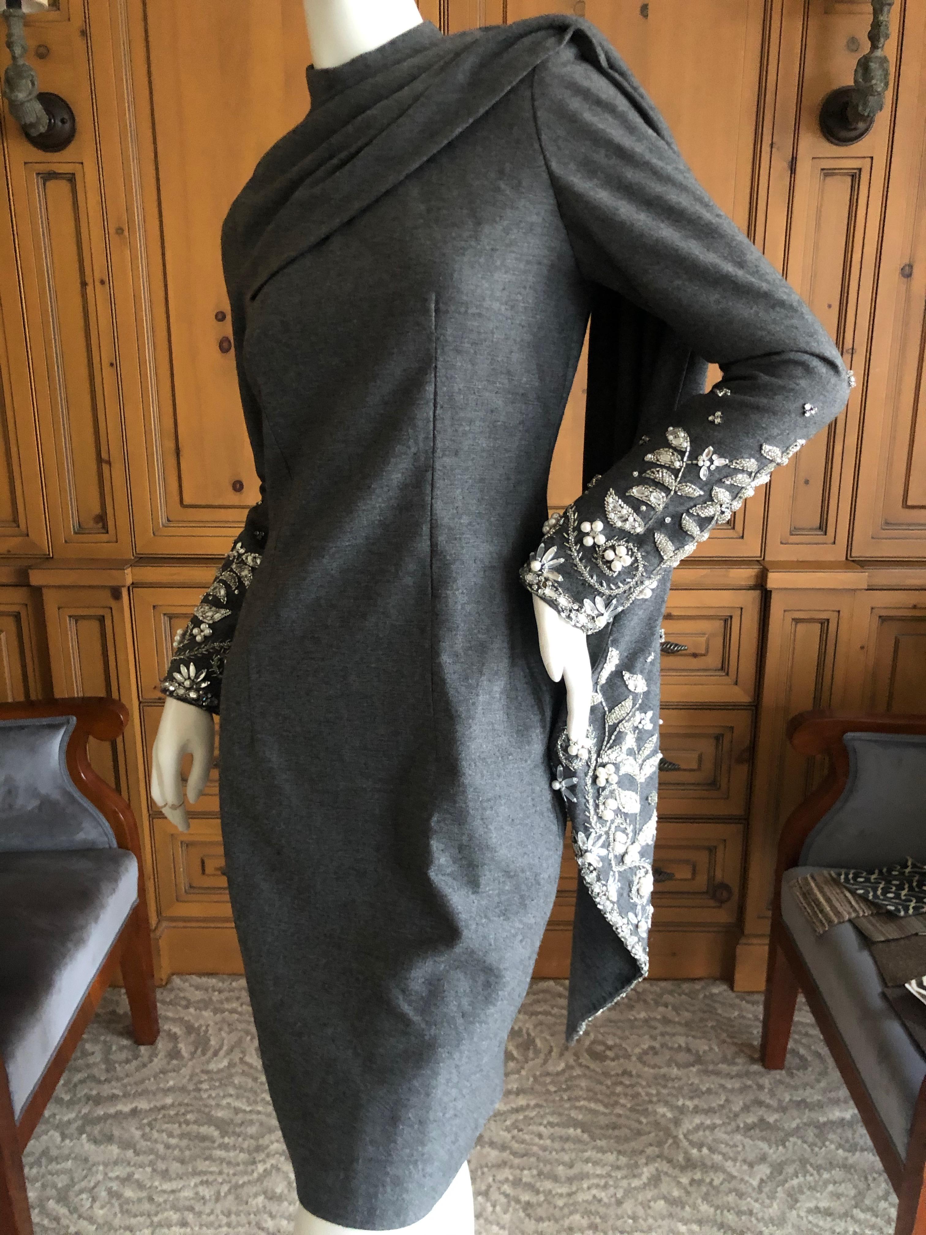 Bill Blass 1980's Gray Cocktail Dress with Crystal & Pearl Embellished Attached Scarf.
Gray wool jersey dress with zipper back, embellished sleeves and attached scarf.
APpx size 6
Bust 35'
Waist 30
