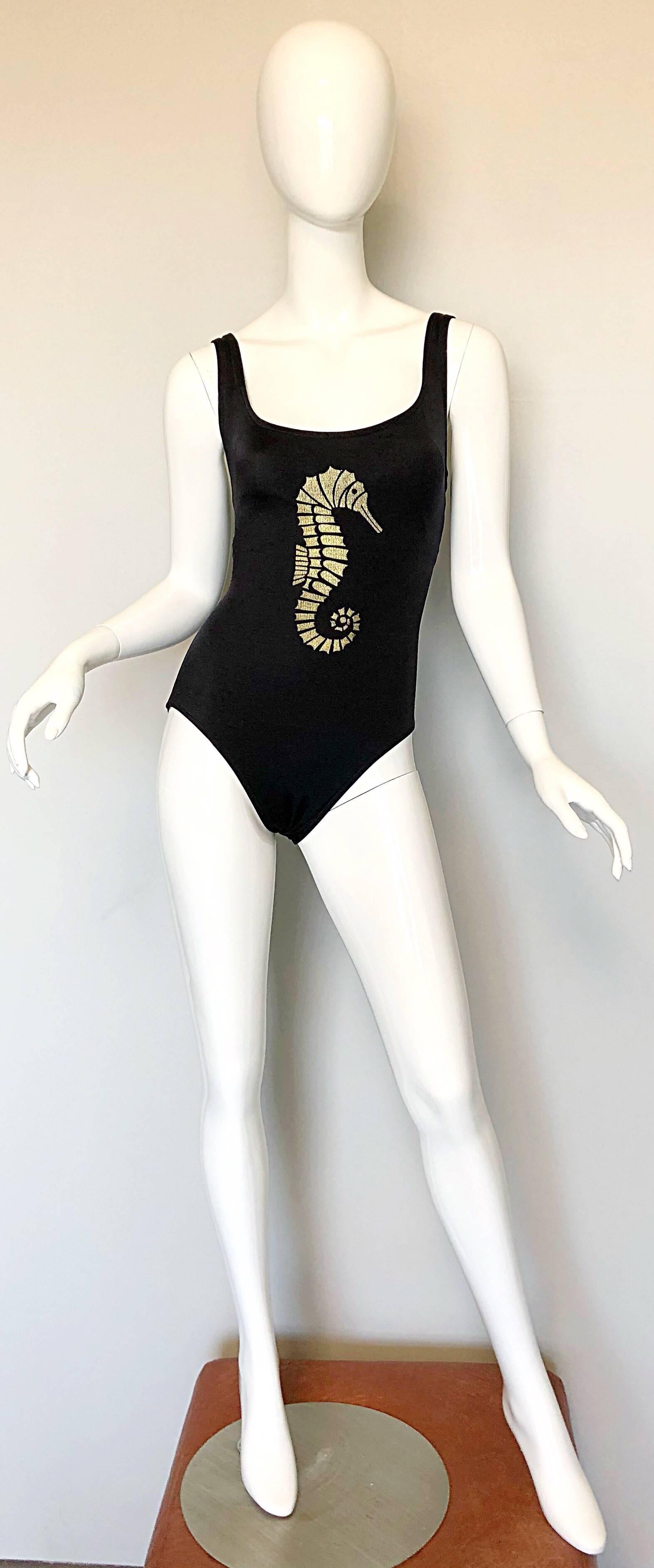 Incredible 90s BILL BLASS one piece seahorse print black and gold novelty swimsuit or bodysuit! Features a soft stretch typical swimsuit fabric that is extremely flattering. Sexy low-cut back reveals just the right amount of skin. Metallic gold