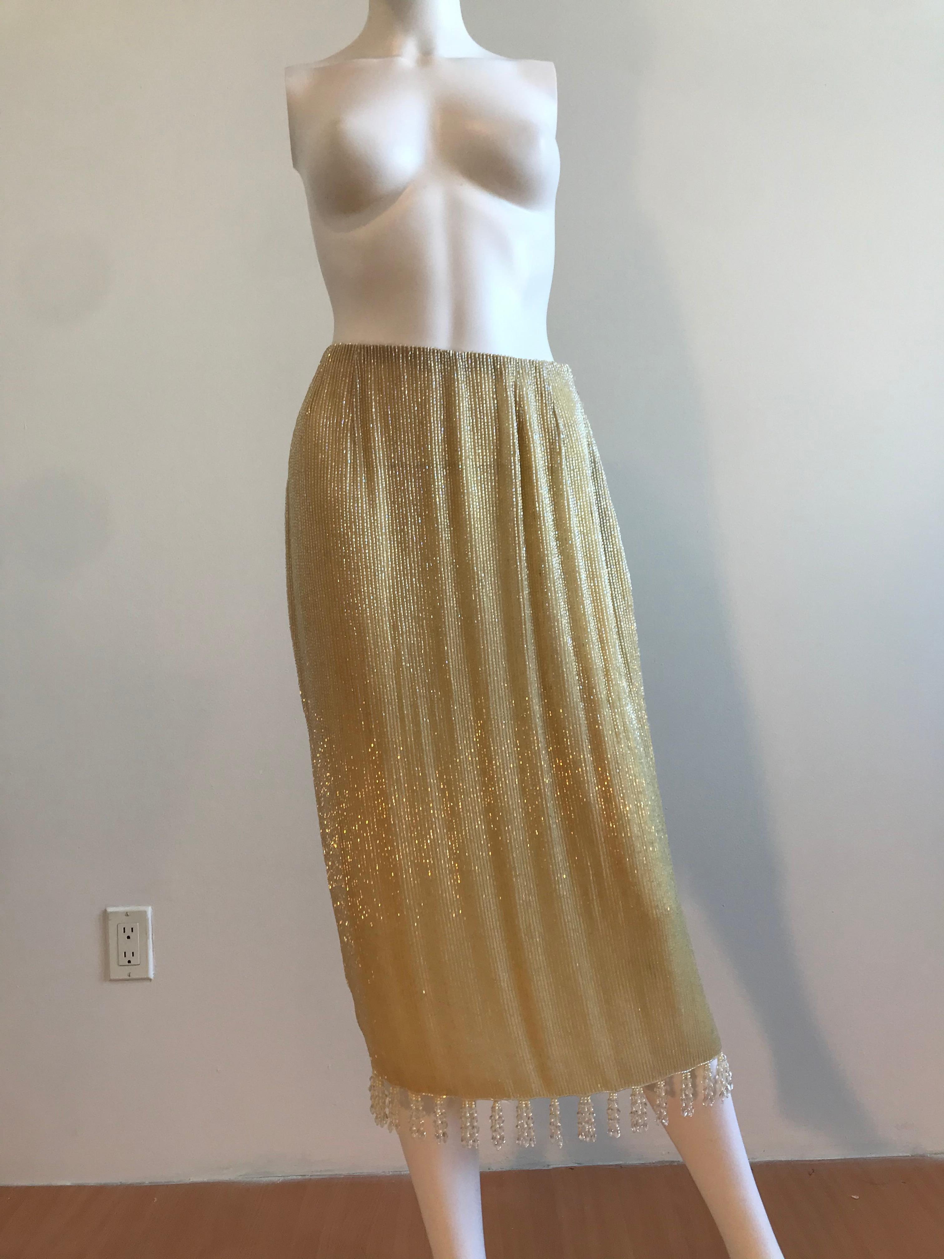 Iconic Bill Blass Bugle Beaded Straight Skirt with Beaded Tassel on the Bottom Hem. Size US 6. Never Worn but one Missing tassel due to storage. Side Zip Closure. Off White - Light Yellow