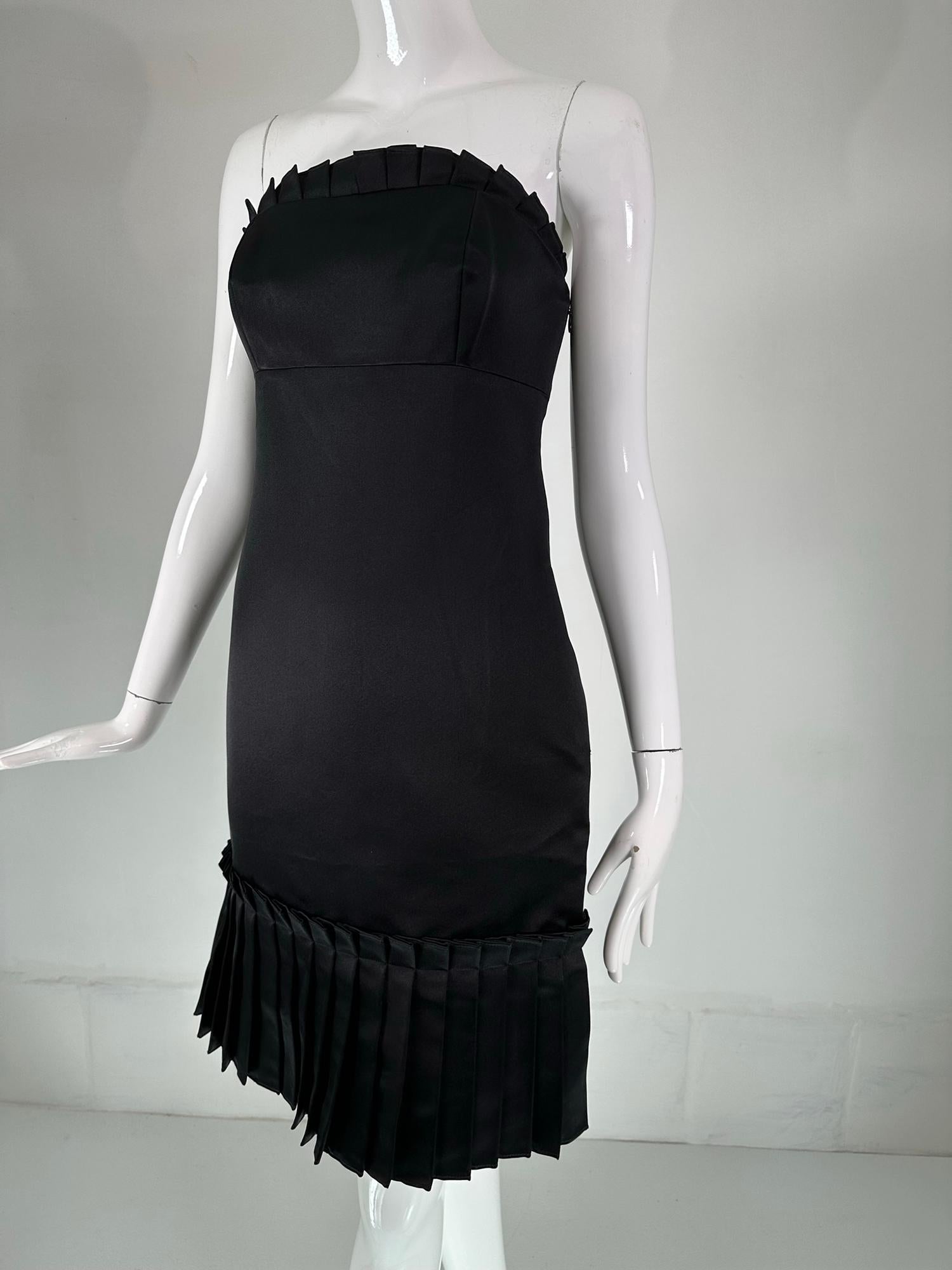 Bill Blass black silk satin strapless fitted cocktail dress with tailored ruffle at the bodice top. A classic and always in style, simple & elegant, this dress is perfect for any special event. Strapless dress has a narrow ruffle band at the top, it