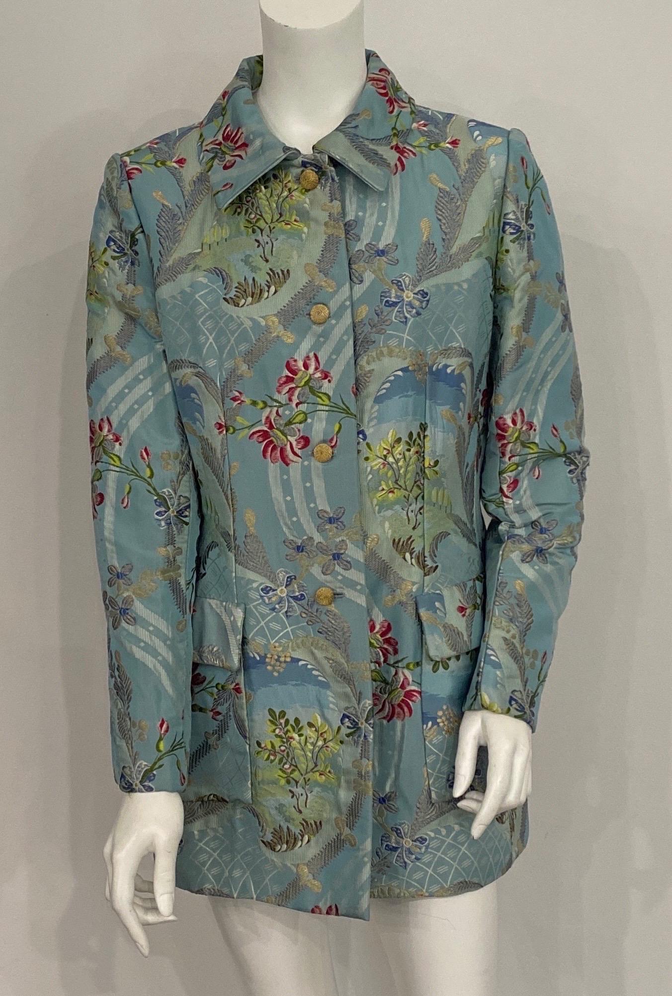 Bill Blass Blue Silk Floral Brocade Long Jacket-Size 6. This late 90's dressy mid-thigh long jacket is made of a beautiful blue silk brocade that has a floral pattern with gold metallic threading throughout. The jacket is fully lined, has 4 gold