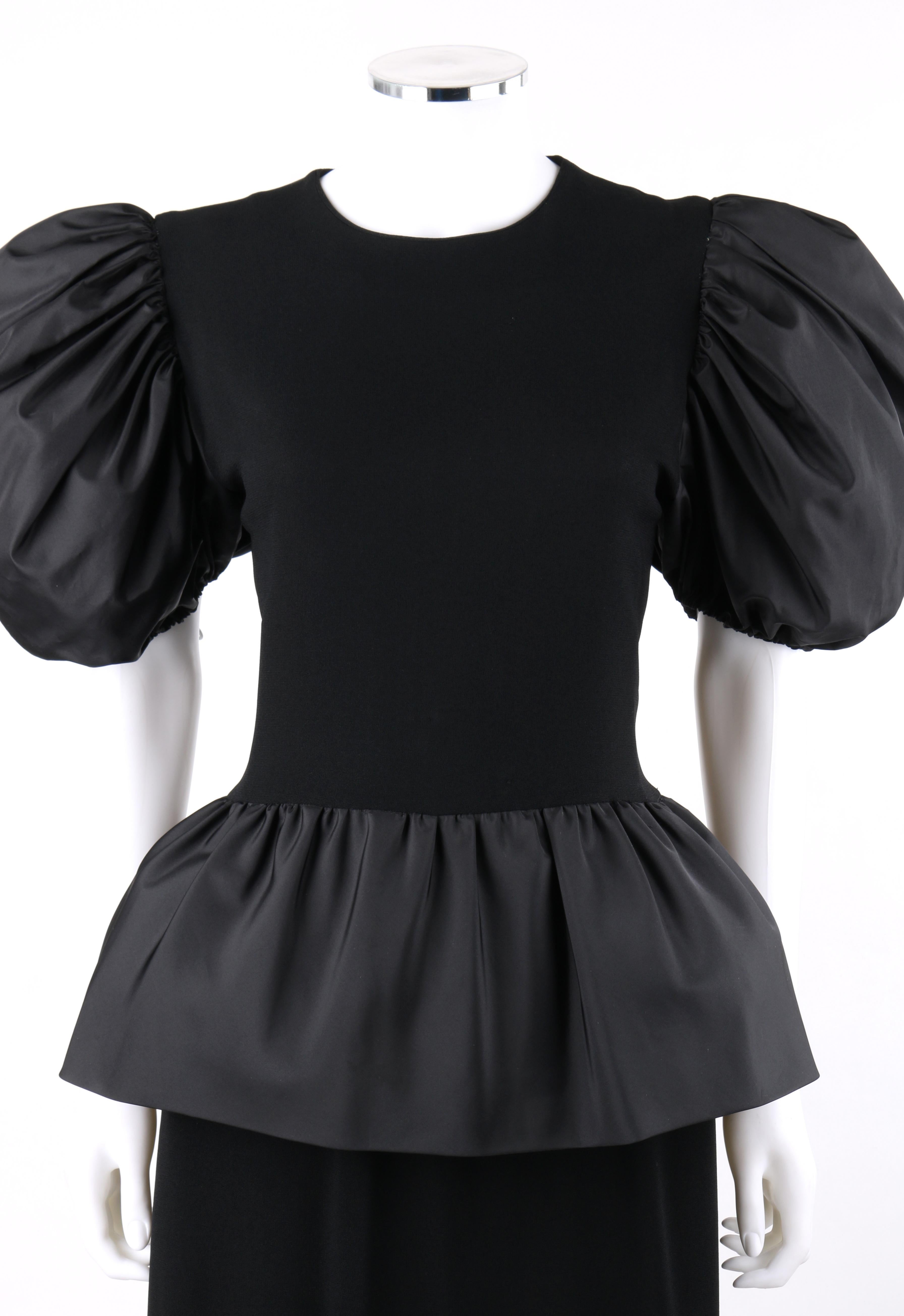BILL BLASS c.1980's Black Crepe Dramatic Puffed Sleeve Peplum Skirt Party Dress
 
Circa: 1980’s
Label(s): Bill Blass Collection III
Designer: Bill Blass
Style: Peplum dress
Color(s): Black (exterior, interior)
Lined: No
Unmarked Fabric Content (feel