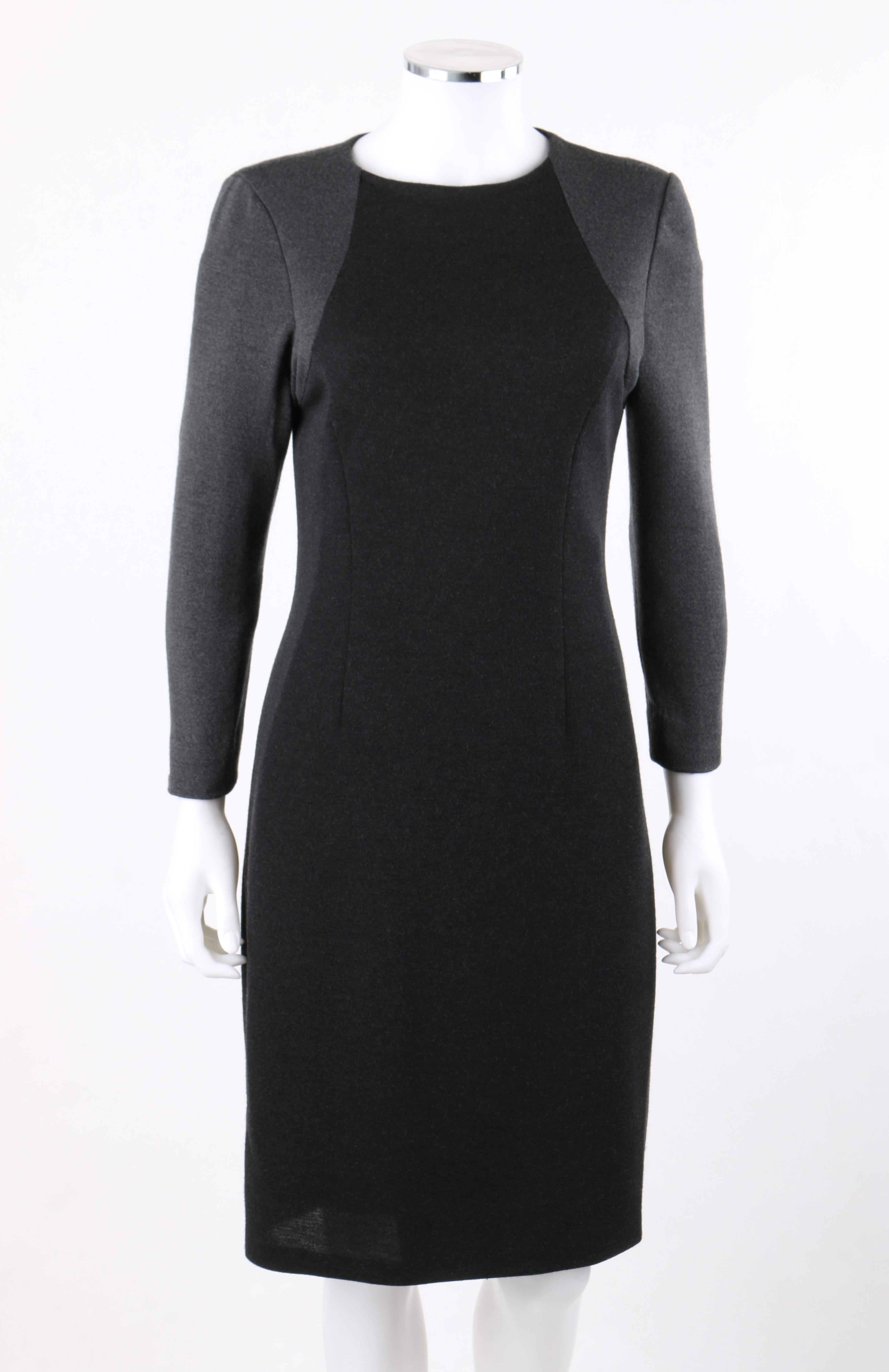 BILL BLASS c.1980’s Gray Black Color Block Long Sleeve Fitted Knit Sheath Dress
 
Circa: 1980’s
Label(s): Bill Blass
Designer: Bill Blass
Style: Long sleeve fitted sheath dress
Color(s): Shades of gray and black
Lined: Yes
Unmarked Fabric Content