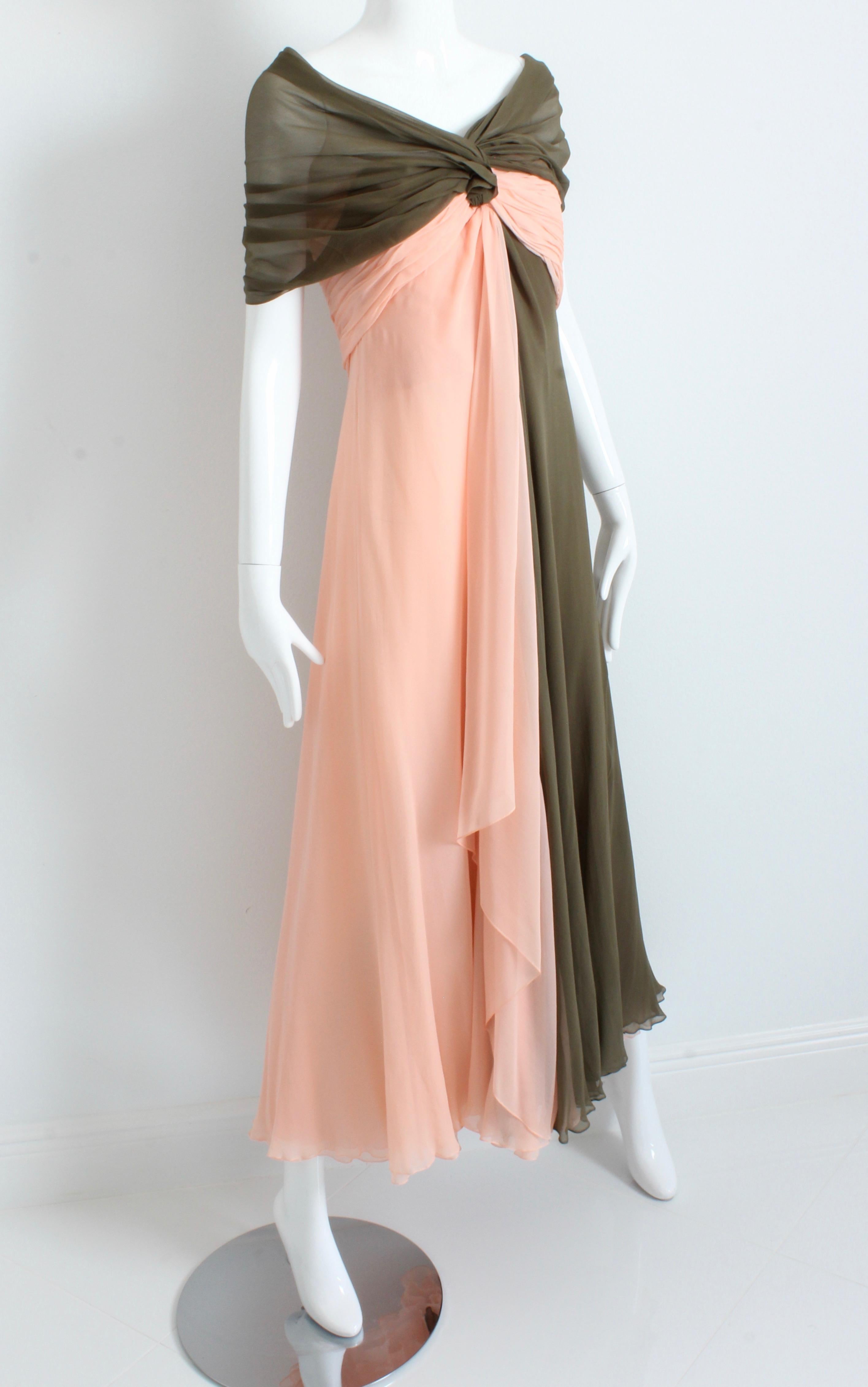 This fabulous evening gown was made by Bill Blass and sold by Martha Palm Beach, most likely in the late 1970s.  It features angelic layers of silk chiffon with a bicolor/color block of peach and olive.  The bodice is draped and pleated with a sheer