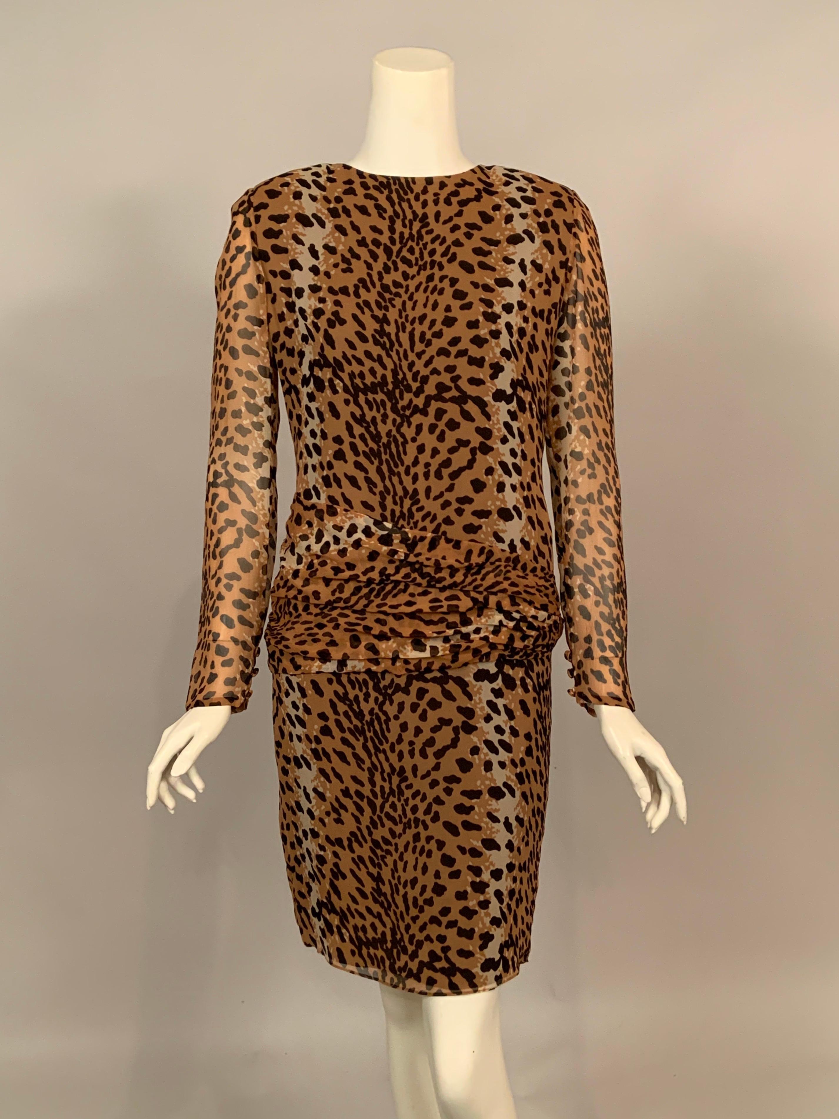 A beautiful spotted cat or leopard print sheer silk chiffon is lined with mocha colored silk for added depth. This eye catching dress has a round neckline, long sleeves with three covered buttons and loops at the wrists, an invisible center back