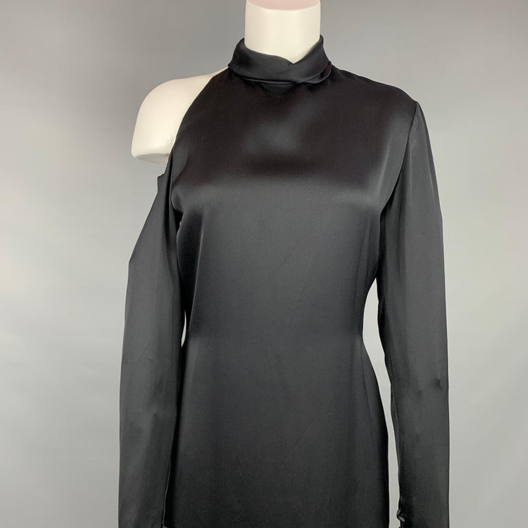 BILL BLASS cocktail dress comes in a black silk featuring a turtleneck, shoulder cut out detail, long sleeves, and a back zipper closure. 

Very Good Pre-Owned Condition.
Marked: Size tag removed.

Measurements:

Shoulder: 5 in.
Bust: 36 in.
Waist: