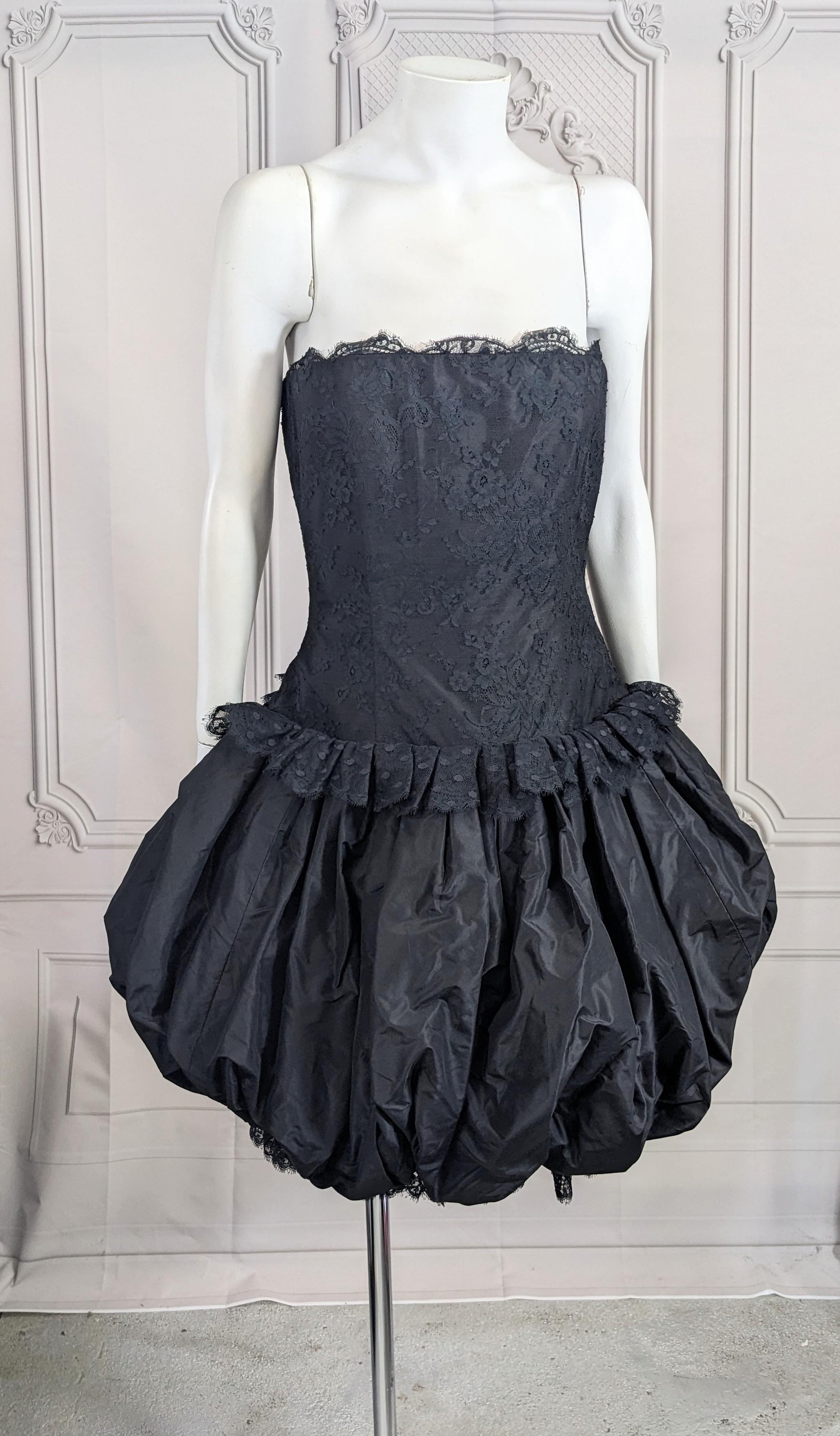 Charming Bill Blass Strapless Lace, Point D'esprit and Taffeta Bubble Cocktail Dress from the 1980's. Corset is overlaid and trimmed in lace. Point D'esprit ruffle at hip which releases to huge silk taffeta bubble skirt anchored with another ruffle