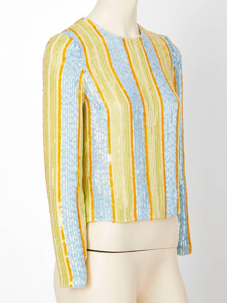 Bill Blass, sequins, on chiffon, pastel toned, striped top having a jeweled neckline, narrow silhouette, and long sleeves. Top ends above the hip with a back zipper closure.