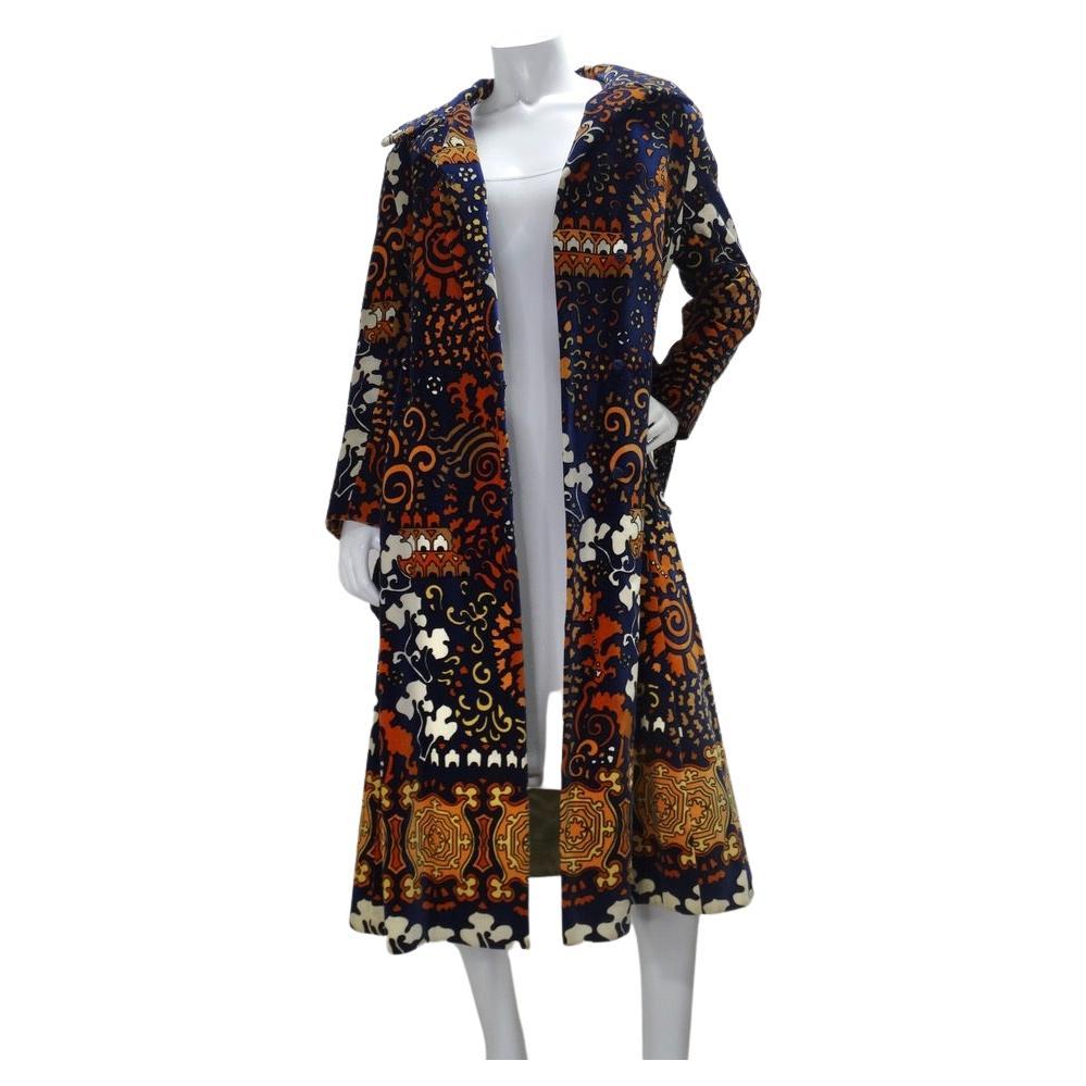 Beautiful vintage Bill Blass for Bond Street trench coat! In a rich navy color with warm neutrals adorned in an abstract pattern. The fabric feels like a thick velour and is lined with a gorgeous light green satin. Button this up fully and flatter