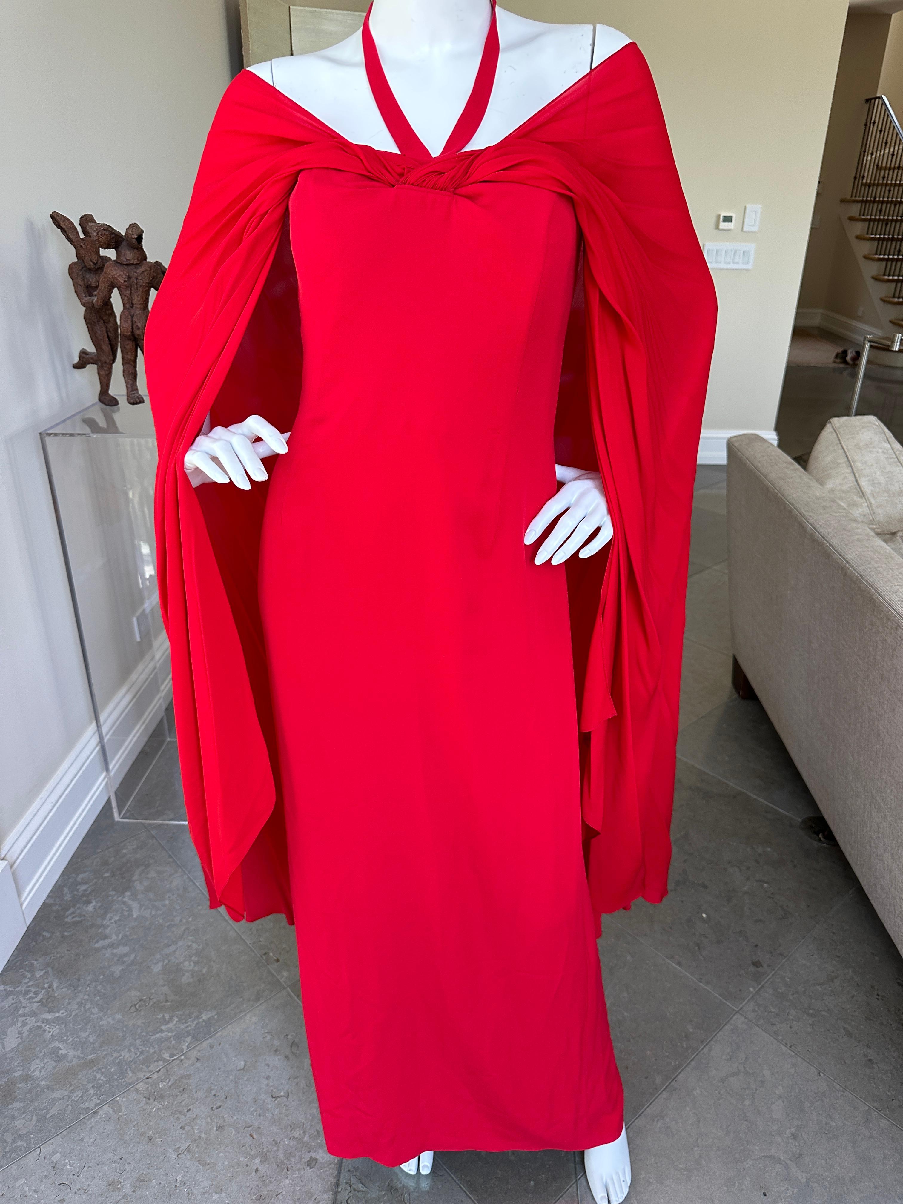 Bill Blass Vintage 1980's Red Silk Evening Dress with Attached Cape.
This is exquisite , it is strapless with an attached large flange of  fabric attached at the bust.
There is an inner corset.
I am not certain how it was originally styled, but I